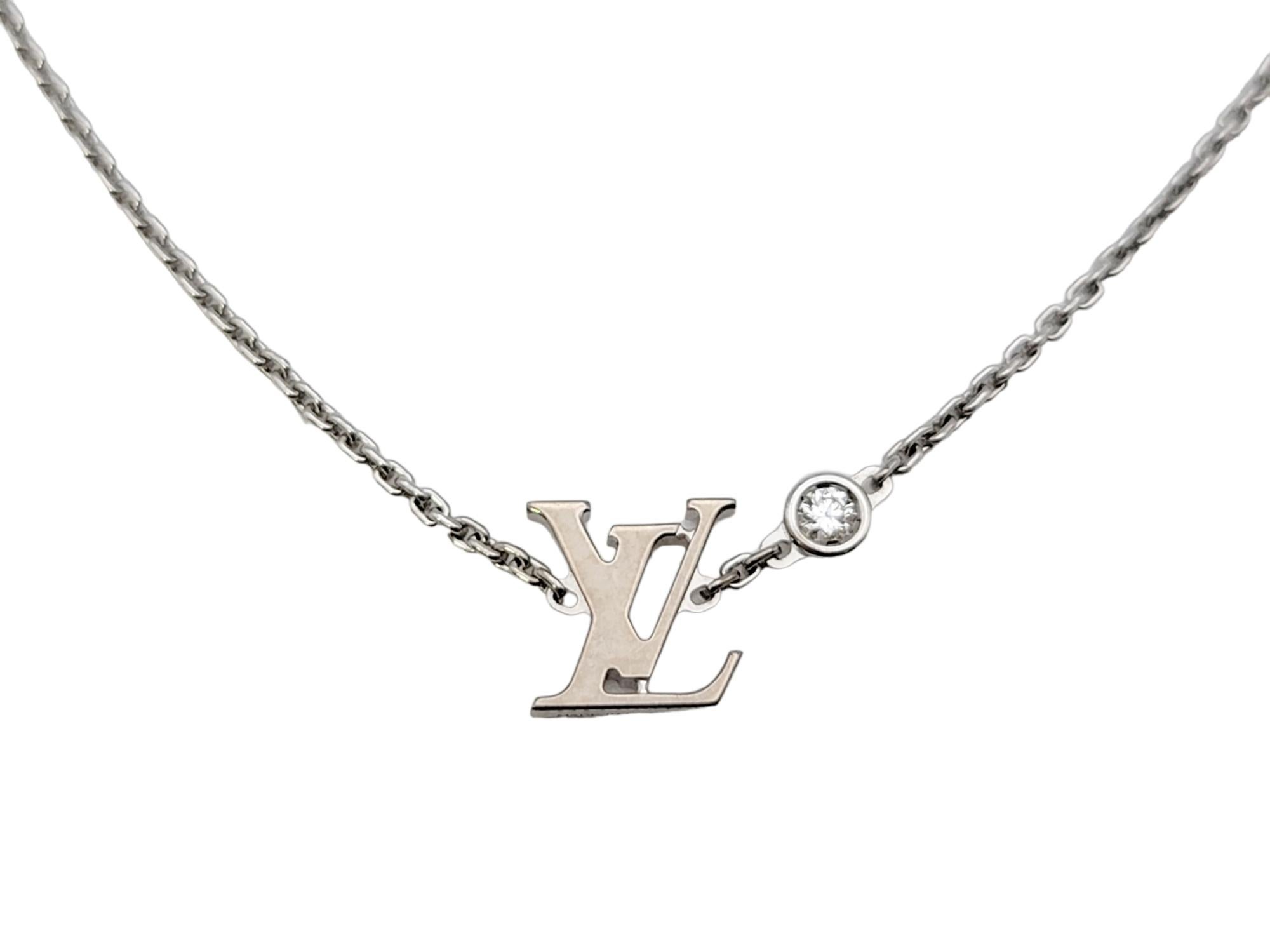 Chic and modern pendant necklace from renowned designer, Louis Vuitton. Features an 18 karat white gold 