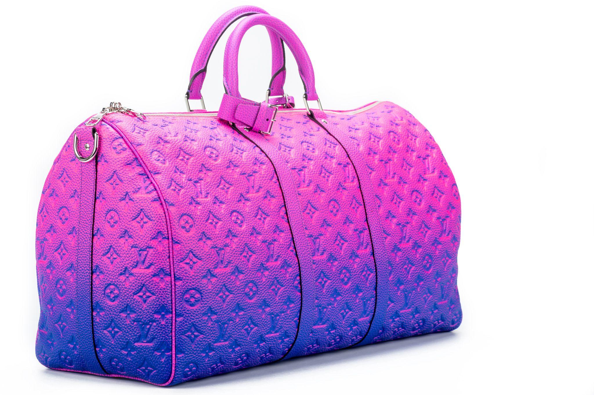 The Louis Vuitton Keepall 50 Bandouliere is made from bull calfskin with a soft multicolored pink. This bag is from the Virgil Abloh Illusion leather collection. Soft side and cabin-friendly, the Keepall 50 bag merits it’s name: the unexpectedly