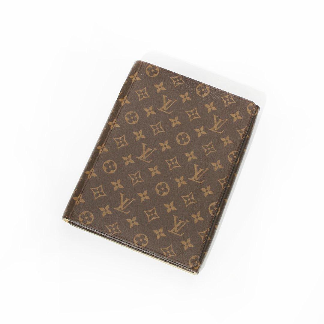 IPad case by Louis Vuitton
Brown canvas leather 
LV monogram logo throughout 
Snap front and back closure
Gold-tone hardware
Flip front turns into a stand 
Made in Italy
Condition: Great condition, wear consistent with age and use. Some creasing and