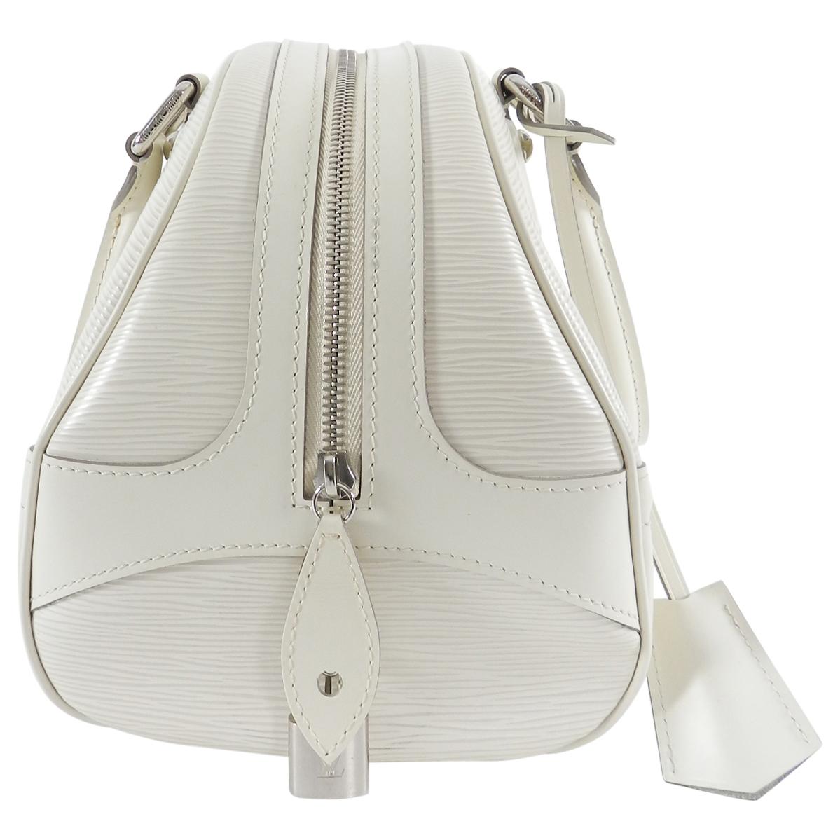 Louis Vuitton Ivory Epi Bowling Montaigne PM Bag.  Zip top design with double handles, clochette, lock, 2 keys.  Ivory textured EPI leather with fabric lined interior and silvertone hardware.  Excellent pre-owned condition.  Date code MI2077 for
