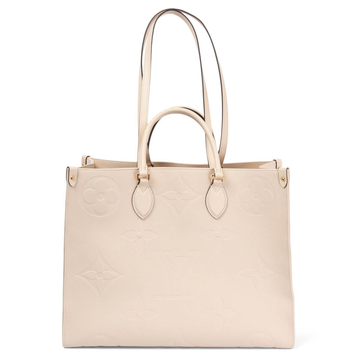 LOUIS VUITTON ivory Giant Monogram Empreinte leather ONTHEGO GM Tote Bag In Excellent Condition In Zürich, CH