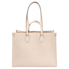 LOUIS VUITTON Elfenbeinfarbene Empreinte Leder-Tragetasche ONTHEGO GM mit Monogramm