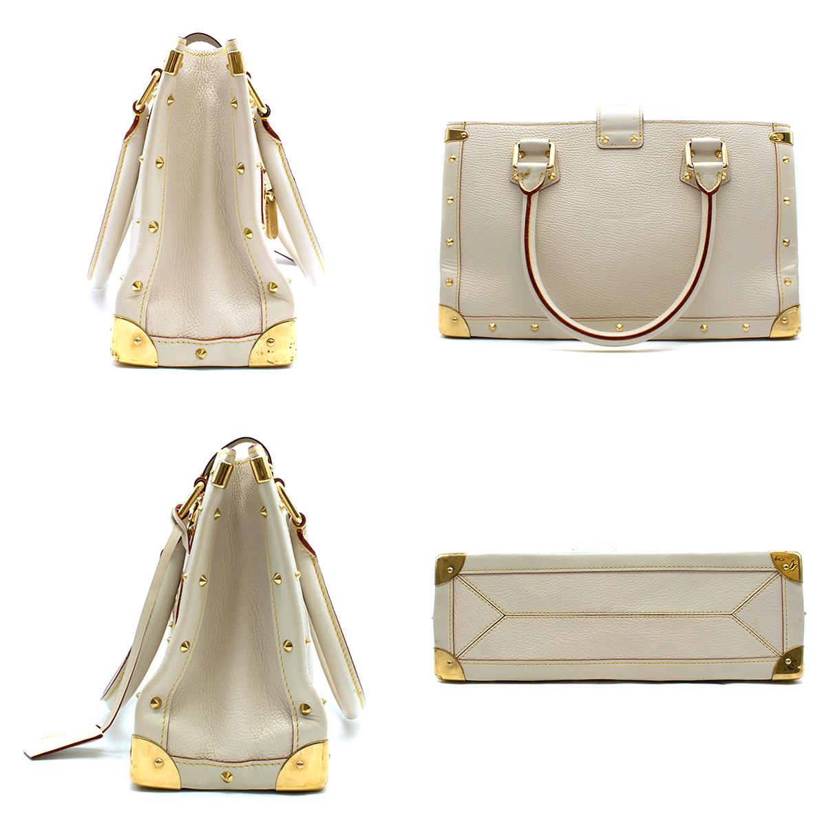 Louis Vuitton Ivory Leather Suhali Le Fabuleux Gold-studded Handbag

- Ivory leather, top-handle handbag
- Gold-tone hardware
-Gold-studded detail
- Tubular handles
- Flap push-botton closure engraved with signature logo
- Front zip pocket
- Leather