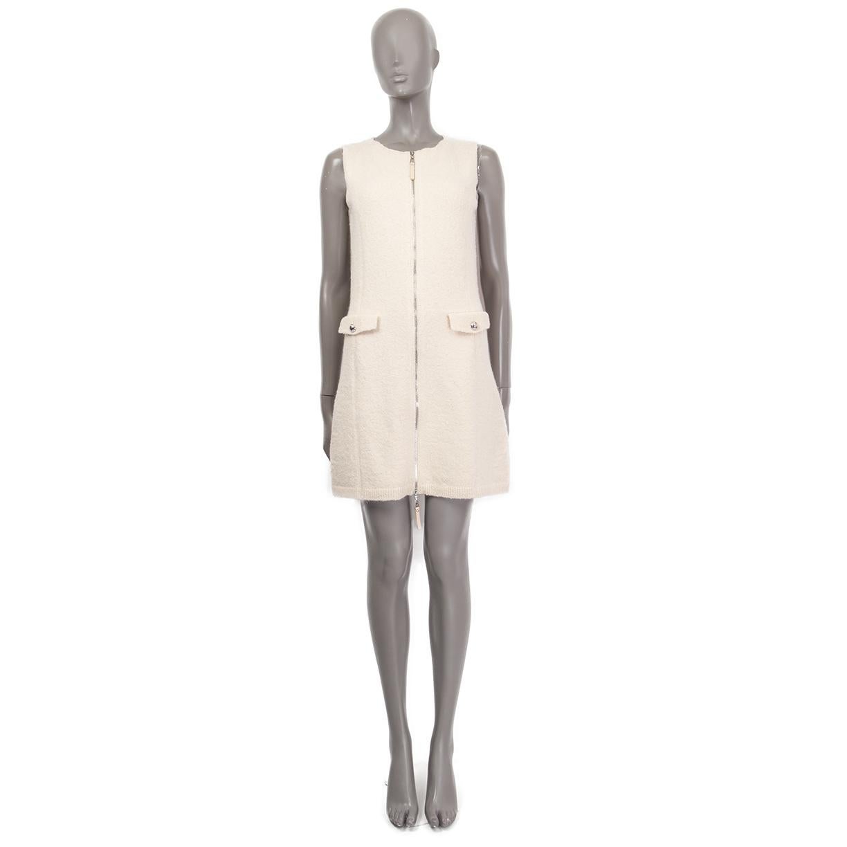 100% authentic Louis Vuitton sleeveless zip-front dress in off-white and cream silk (53%), mohair (22%), polyamide (16%), elastane (5%) and wool (4%). Has two faux flap pockets on the front with silver-tone logo buttons. Lined in silk (with 6%