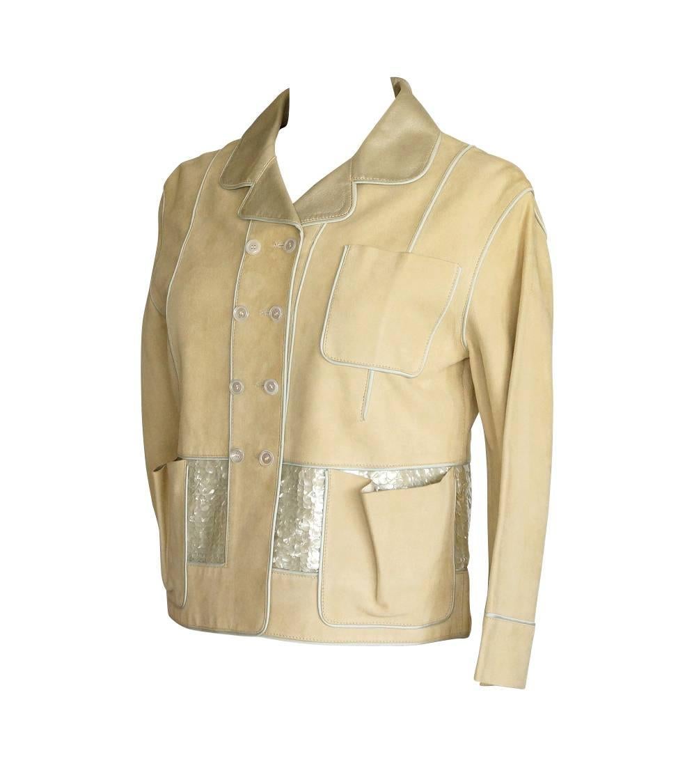 Guaranteed authentic Louis Vuitton lambskin suede and leather jacket.
3/4 Sleeve jacket accentuated with pale silvery gray textile piping.
Hip area is adorned with 3.75