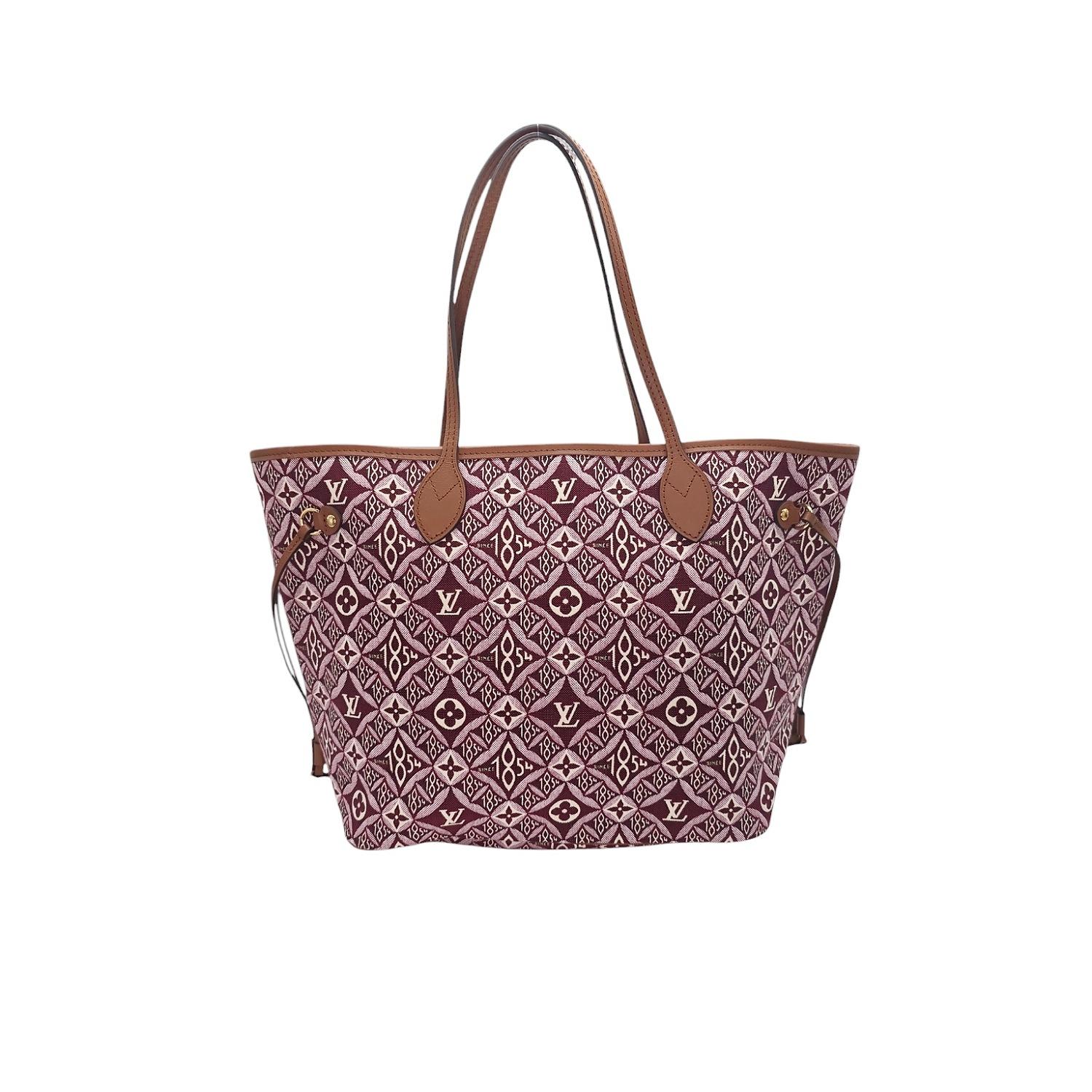 Elevate your style with the iconic Louis Vuitton Neverfull MM Tote. Crafted from luxurious red and white Jacquard Since 1854 textile, this designer tote features brown cowhide leather trim, gold hardware, and a spacious interior with a matching