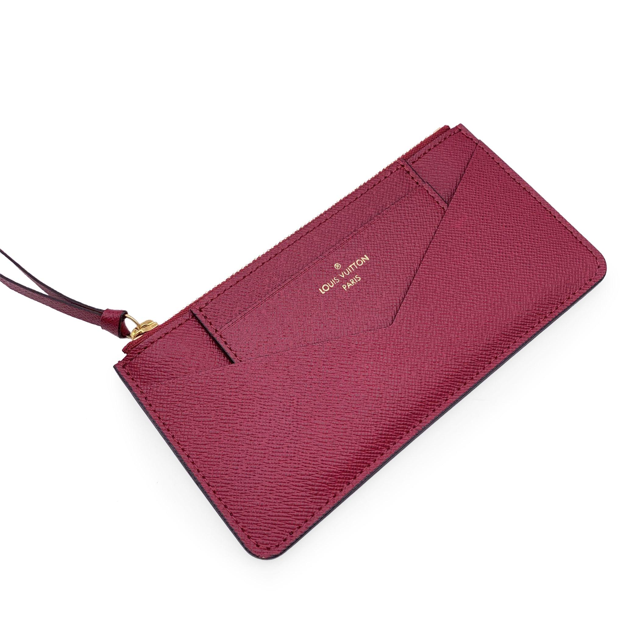 A set of 2 Louis Vuitton's Accessories for the Jeanne wallet: 1 zippered pouch for coins, to be inserted inside the main compartment of the wallet and 1 removable card holder to be inserted in the front pocket. Crafted in magenta leather. 'Louis