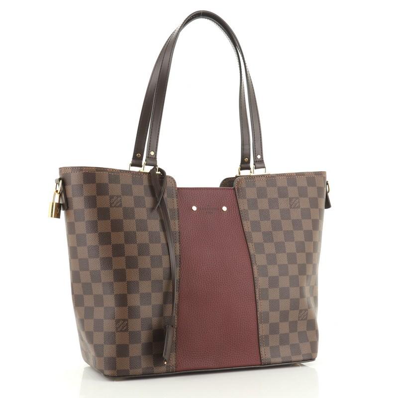 This Louis Vuitton Jersey Handbag Damier with Leather, crafted in damier ebene coated canvas with purple leather, features dual flat leather handles, protective base studs, and gold-tone hardware. Its zip closure opens to a purple microfiber