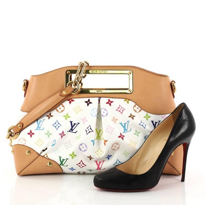 This authentic Louis Vuitton Judy Handbag Monogram Multicolor MM is a vibrant and colorful bag perfect for everyday. Featuring Takashi Murakami's popular white monogram multicolor coated canvas, this feminine bag features a logo engraved cut-out