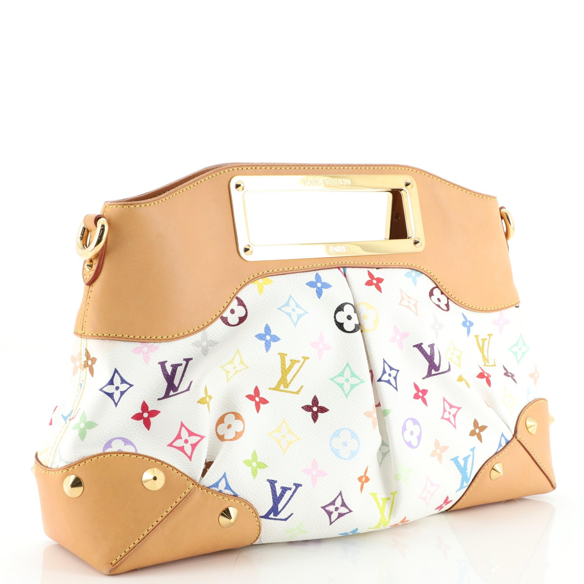 Condition: Very good. Moderate darkening, scuffs, creasing and watermarks on shoulder pad and leather trims, wear in interior, scratches on hardware.
Accessories: With Strap
Measurements: Handle Drop 1.5