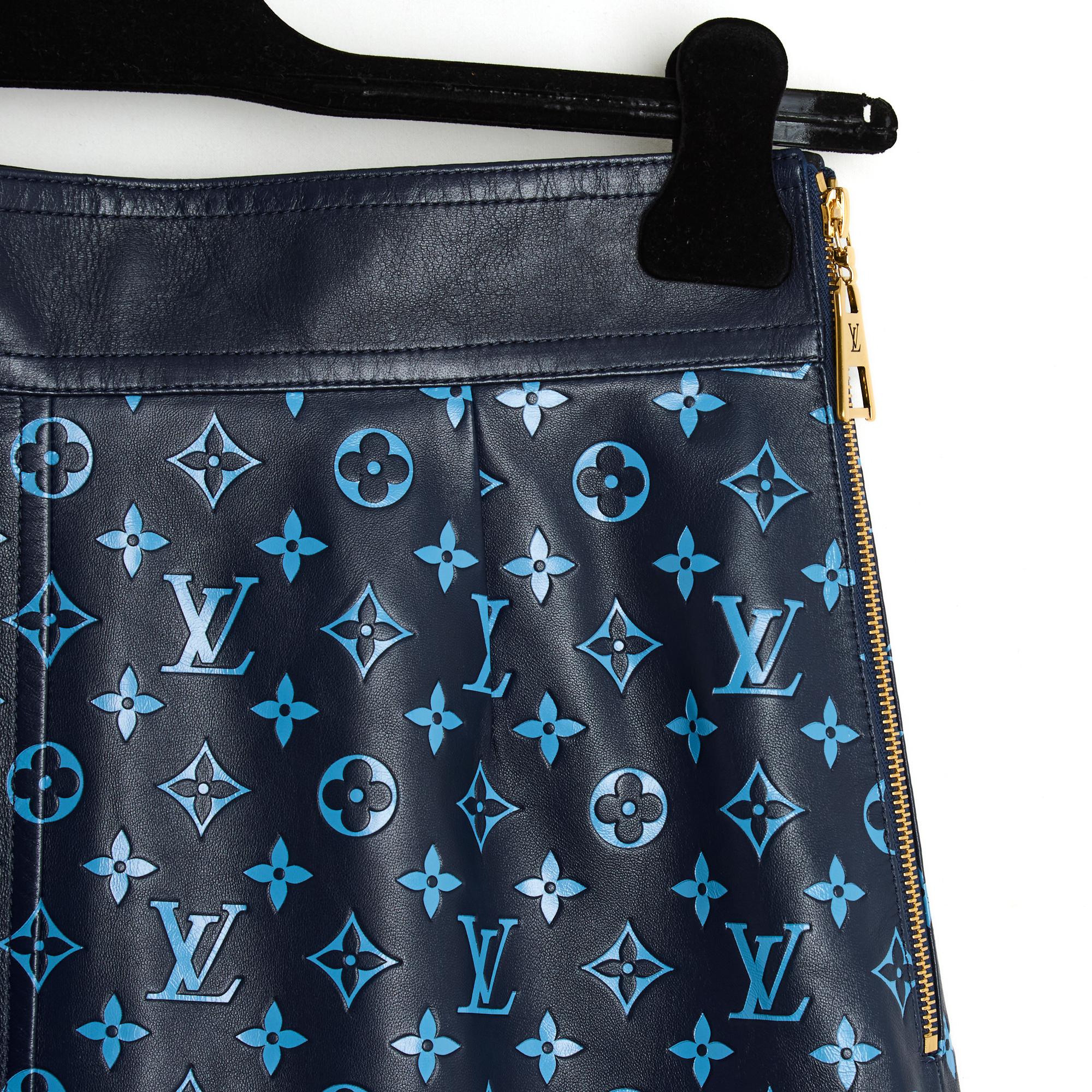 Louis Vuitton A-line or slightly trapeze style skirt in soft navy blue leather printed monogram pattern in medium blue, fastening with a long gold metal zip with the LV logo, satin canvas lining with the Louis Vuitton logo. Size 40FR, i.e. UK 12 and