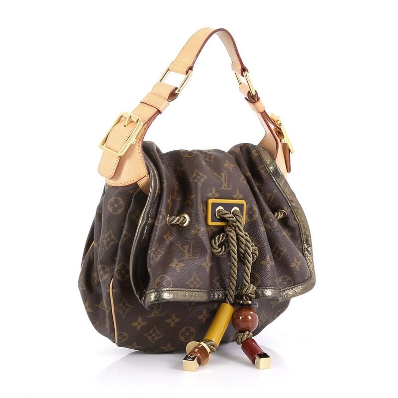 This Louis Vuitton Kalahari Handbag Monogram Canvas PM, crafted in brown monogram coated canvas, features a single loop vachetta handle, pleated front details with drawstring rope accents, polished red and yellow resin beads, and gold-tone hardware.