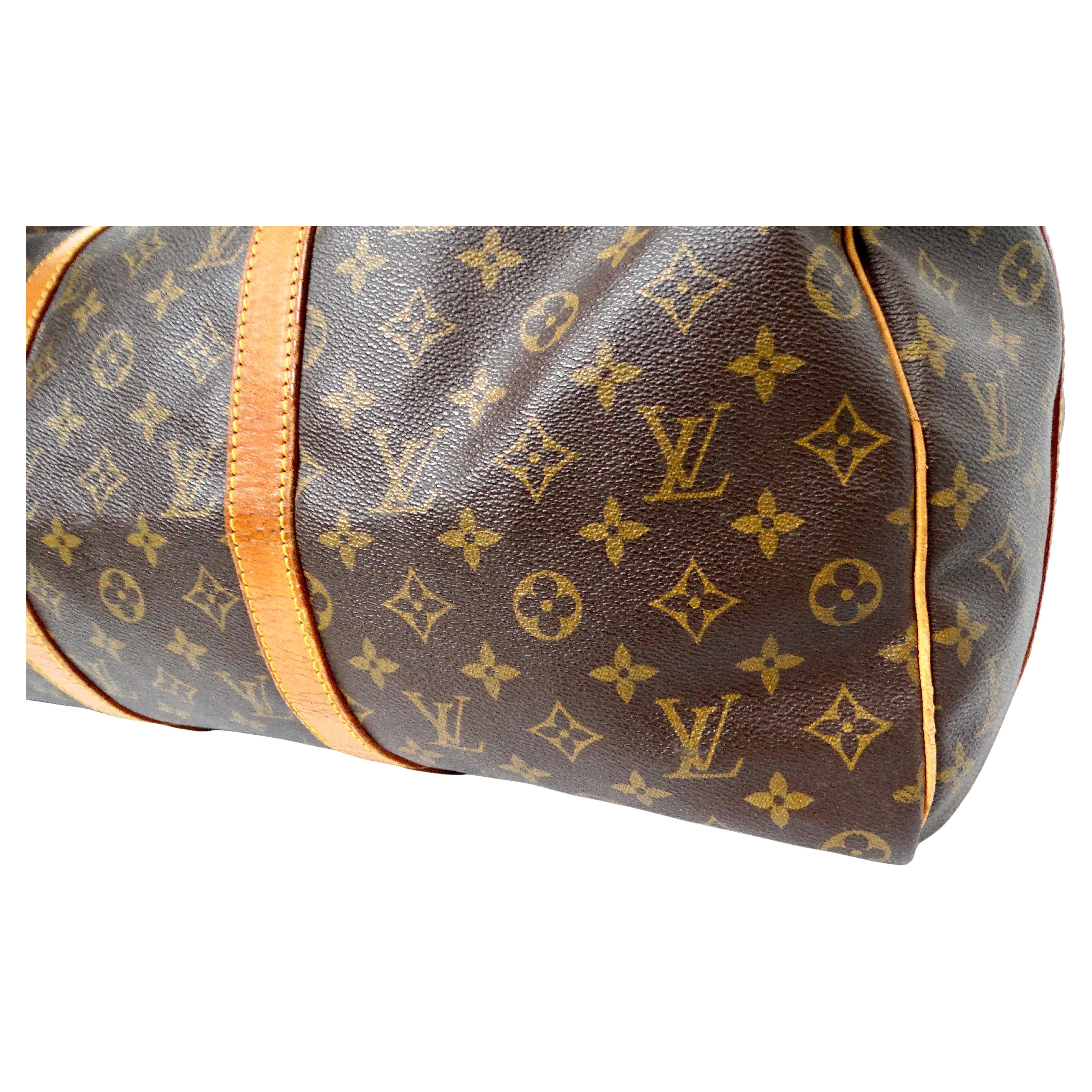 The Louis Vuitton Keepall 50 Monogram Coated Canvas Duffel Bag is a timeless vintage piece that epitomizes luxury and practicality. Crafted from iconic Monogram coated canvas, this bag exudes classic sophistication with its instantly recognizable LV