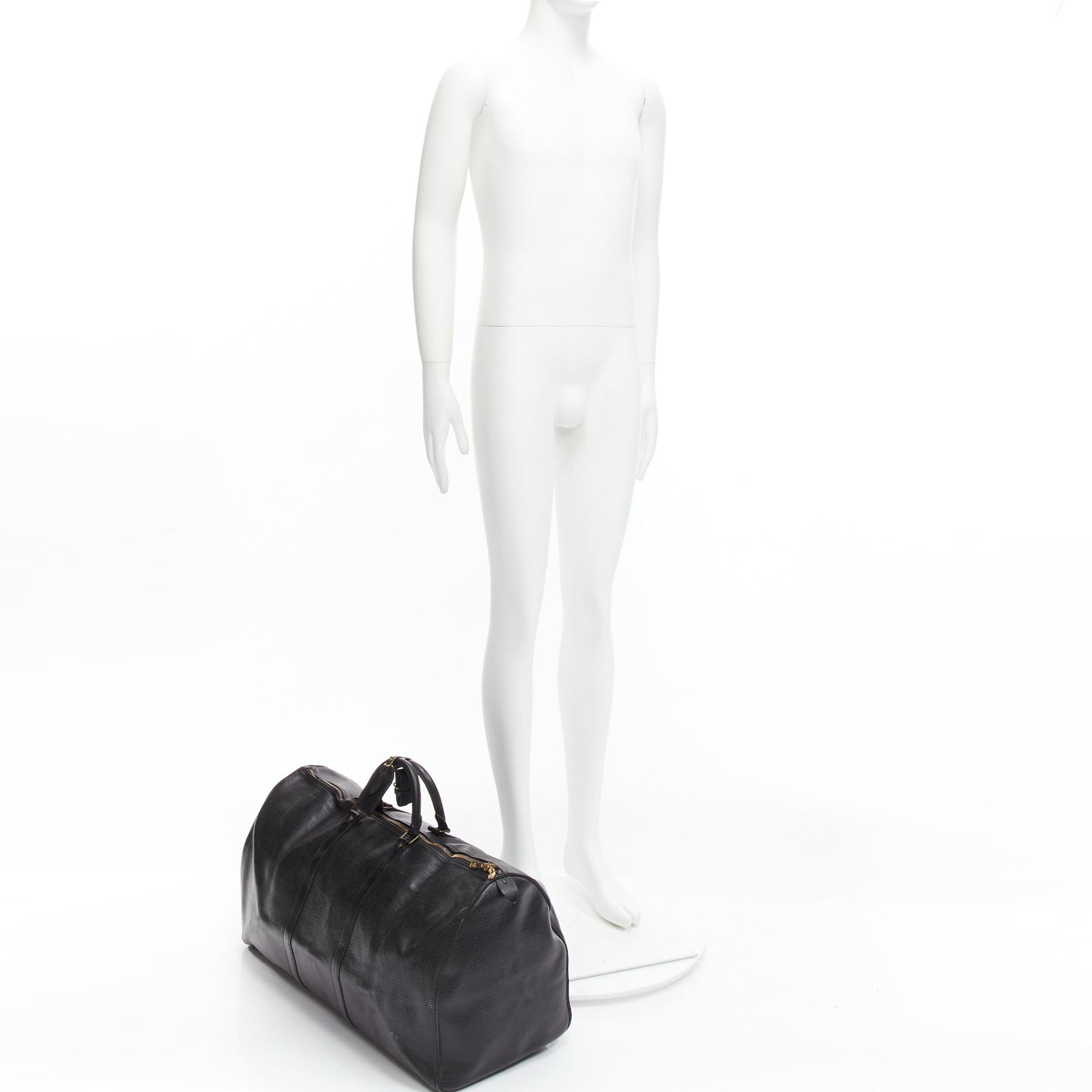 LOUIS VUITTON Keepall 55 black epi leather LV logo GHW travel bag
Reference: GIYG/A00378
Brand: Louis Vuitton
Model: Keepall 60
Collection: Epi
Material: Leather
Color: Black, Gold
Pattern: Abstract
Closure: Zip
Lining: Black Leather
Made in: