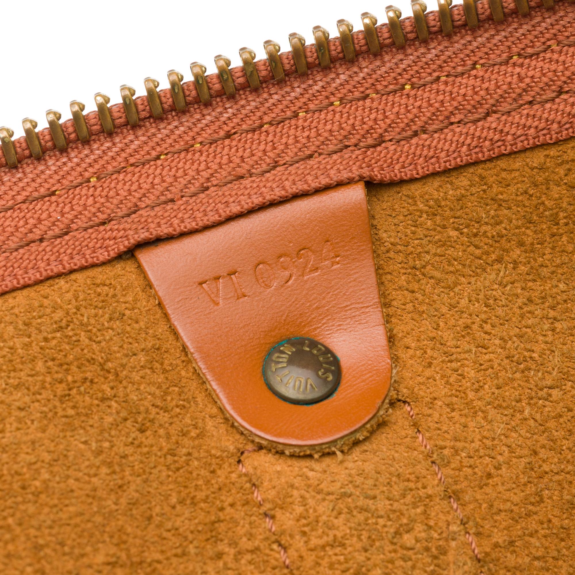 Orange Louis Vuitton Keepall 55 in cognac épi leather