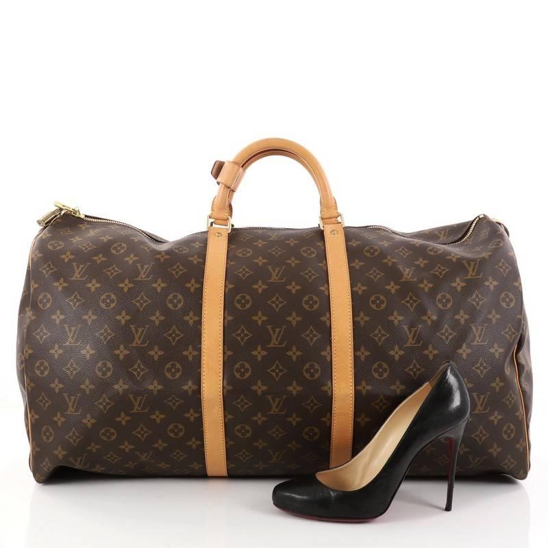 This authentic Louis Vuitton Keepall Bag Monogram Canvas 60 is the perfect purchase for a weekend trip, and can be effortlessly paired with any outfit from casual to formal. Crafted with traditional Louis Vuitton brown monogram coated canvas, this