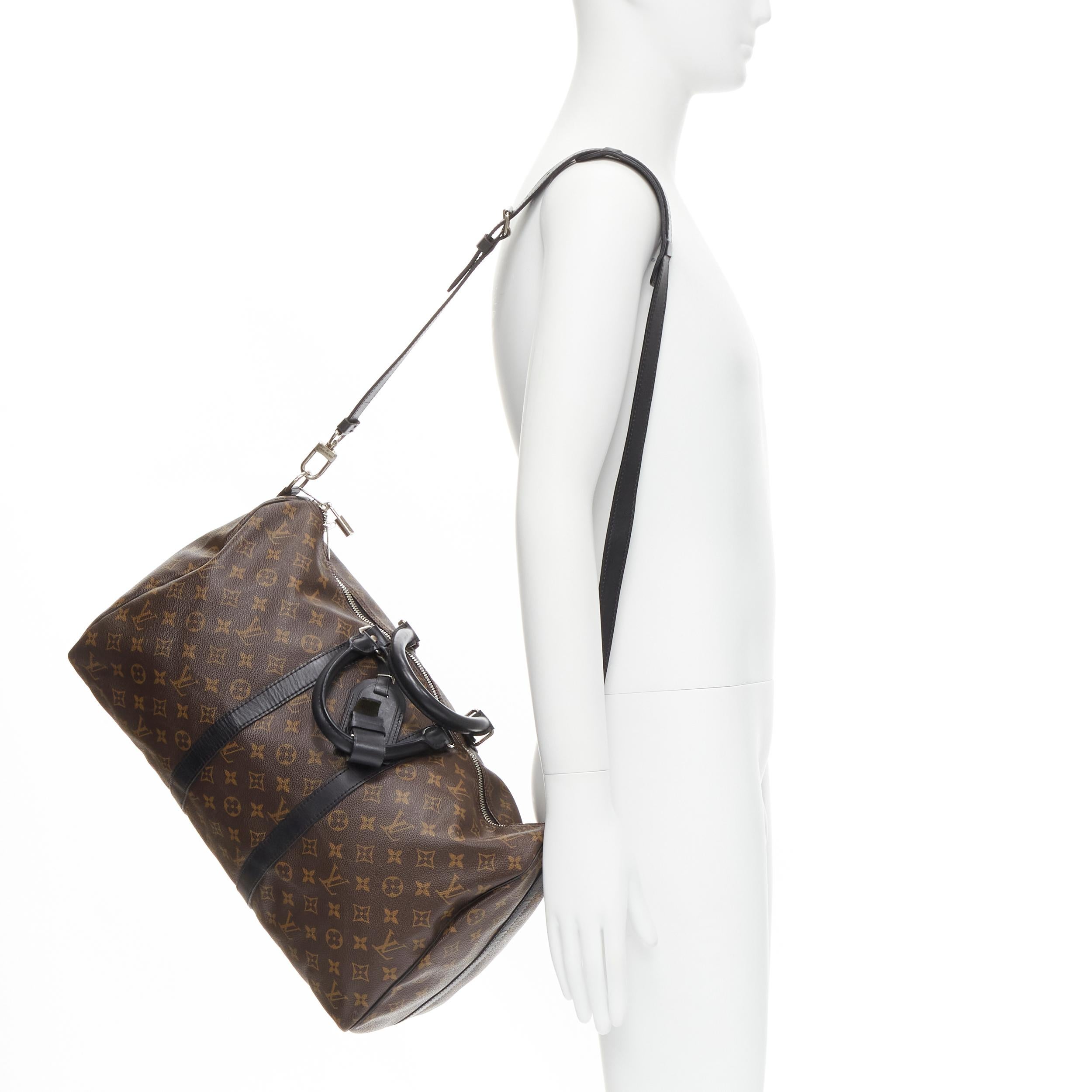 LOUIS VUITTON Keepall Bandouliare 45 Monogram Macassar brown black carryall bag 
Reference: TALI/A00013 
Brand: Louis Vuitton 
Model: Keepall BandouliâˆšÂ®re 45 
Material: Canvas 
Color: Brown 
Pattern: Solid 
Closure: Zip 
Extra Detail: Louis