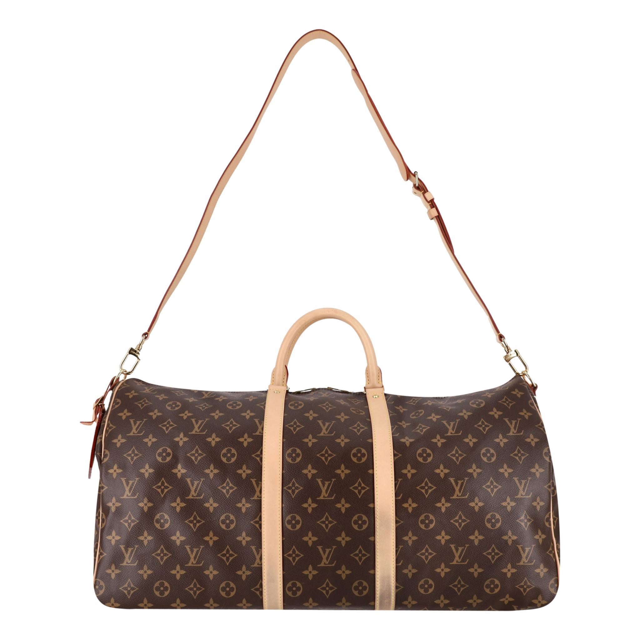 Louis Vuitton Keepall Bandoulière 60 Monogram Coated Canvas Travel Bag

Classic brown monogram canvas travel bag with beige leather details and detachable, adjustable shoulder strap.

Featuring gold, branded hardware and bright yellow stitching