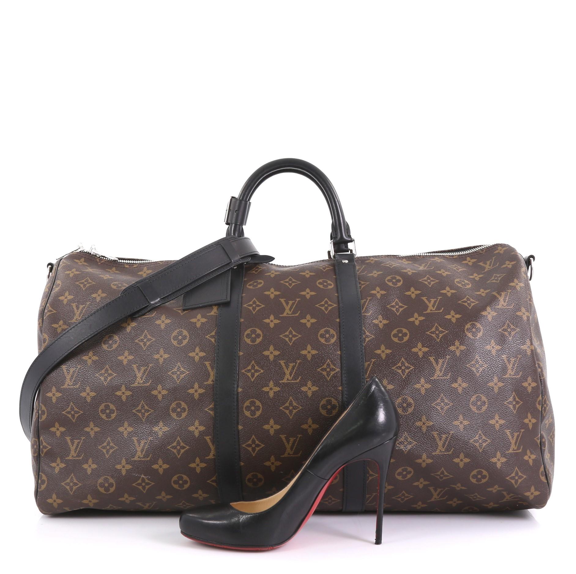 This Louis Vuitton Keepall Bandouliere Bag Macassar Monogram Canvas 55, crafted in brown macassar monogram coated canvas and black leather, features dual rolled leather handles, leather trim, and silver-tone hardware. Its two-way zip closure opens