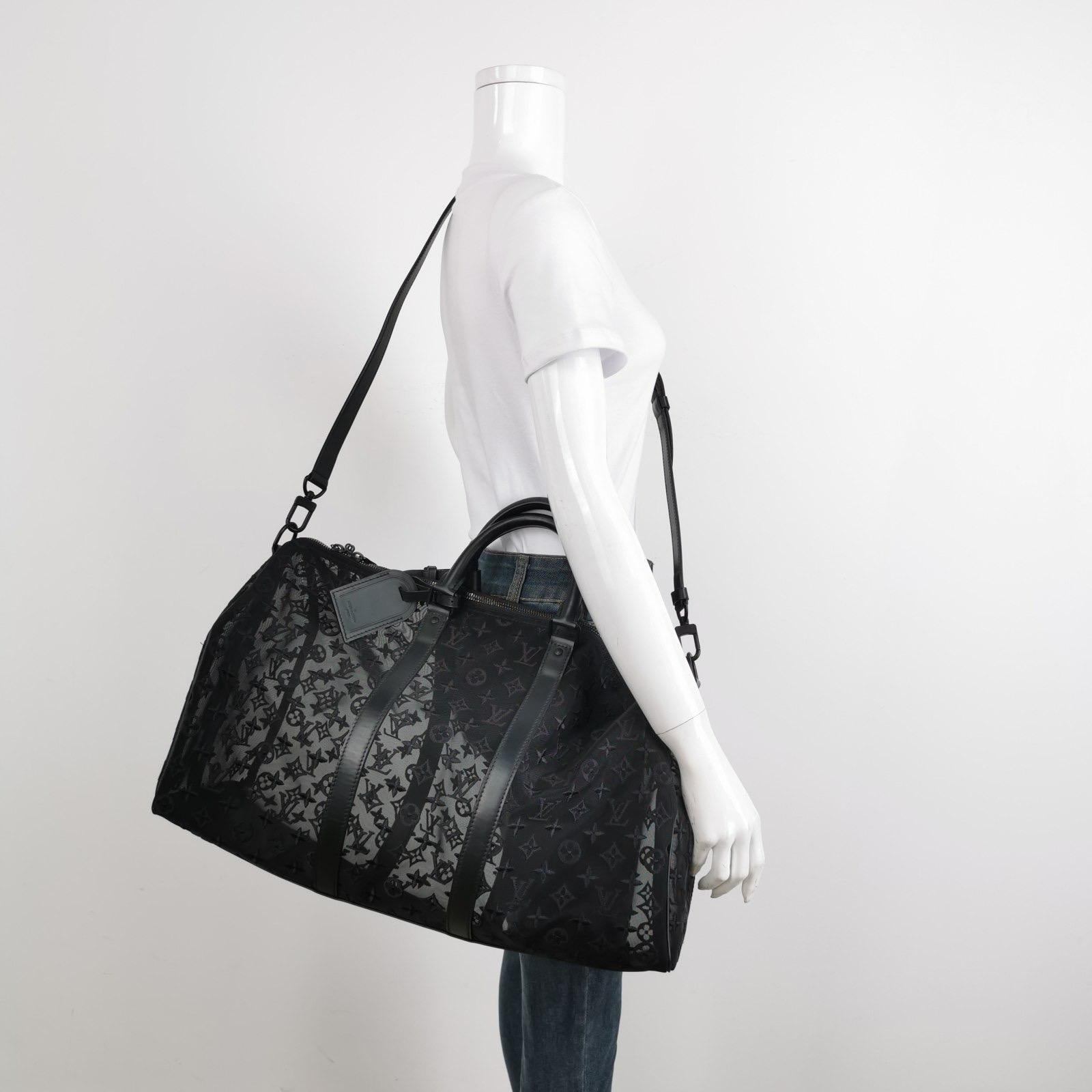 This Louis Vuitton Keepall Bandouliere Monogram Mesh 50 Black duffle bag in Mesh / Leather with transparent mesh monogram is the coveted piece of limited collection by acclaimed artistic director of menswear Virgil Abloh.

This mesh bag features