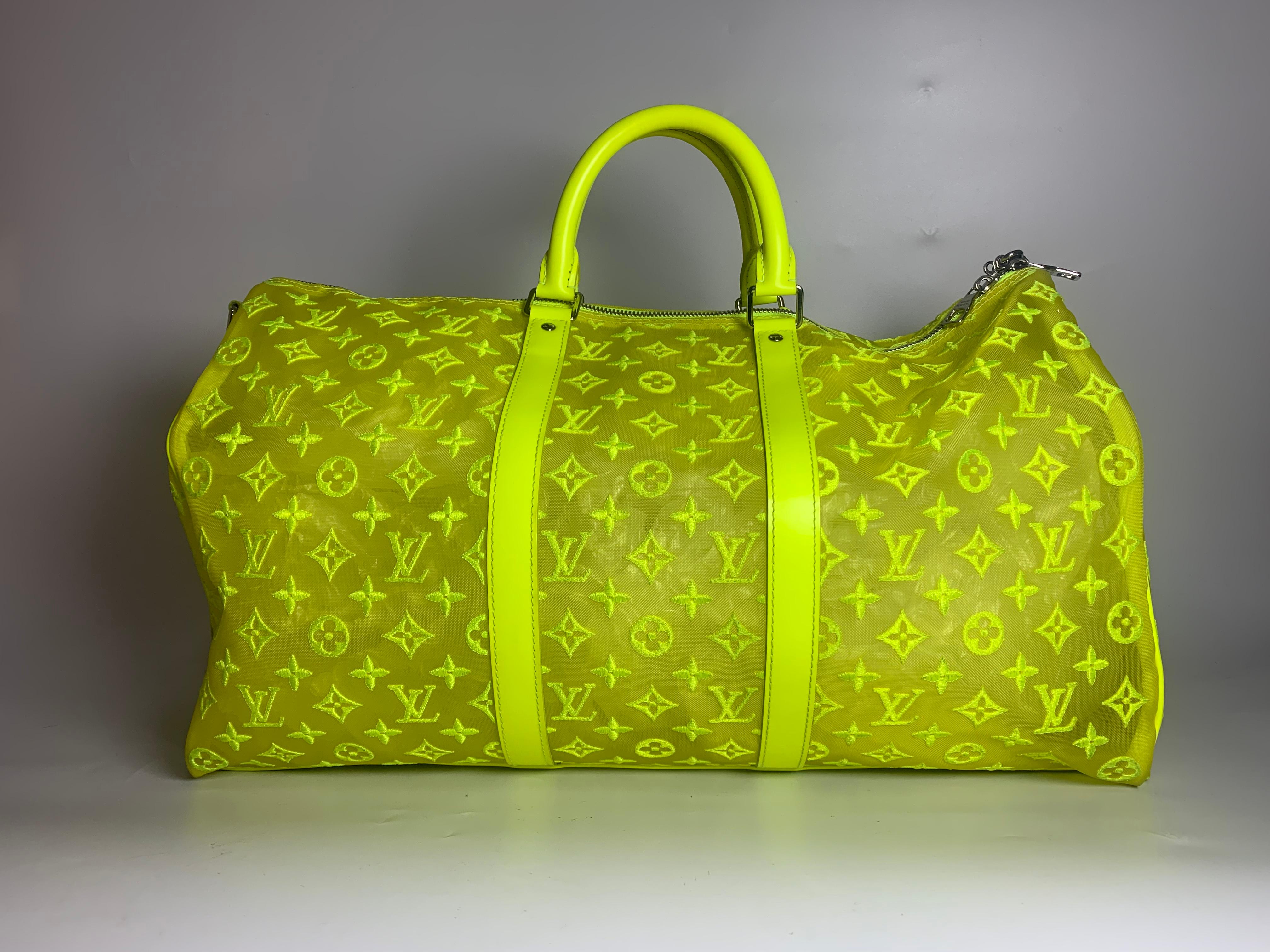 This Louis Vuitton Keepall Bandouliere Monogram Mesh 50 Neon Yellow duffle bag in Mesh / Leather with transparent mesh monogram is the coveted piece of limited collection by acclaimed artistic director of menswear Virgil Abloh.

This eye-catching