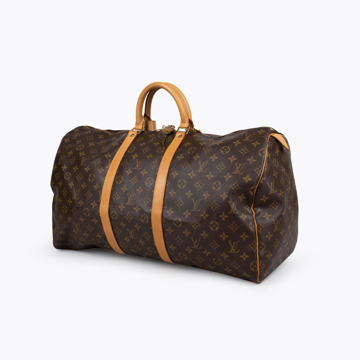 Brown and tan monogram coated canvas Louis Vuitton Keepall Monogram 55 with

- Brass hardware
- Tan vachetta leather trim
- Dual rolled top handles
- Tonal canvas lining and two-way zip closure at top

Overall Preloved Condition: Very Good
Exterior