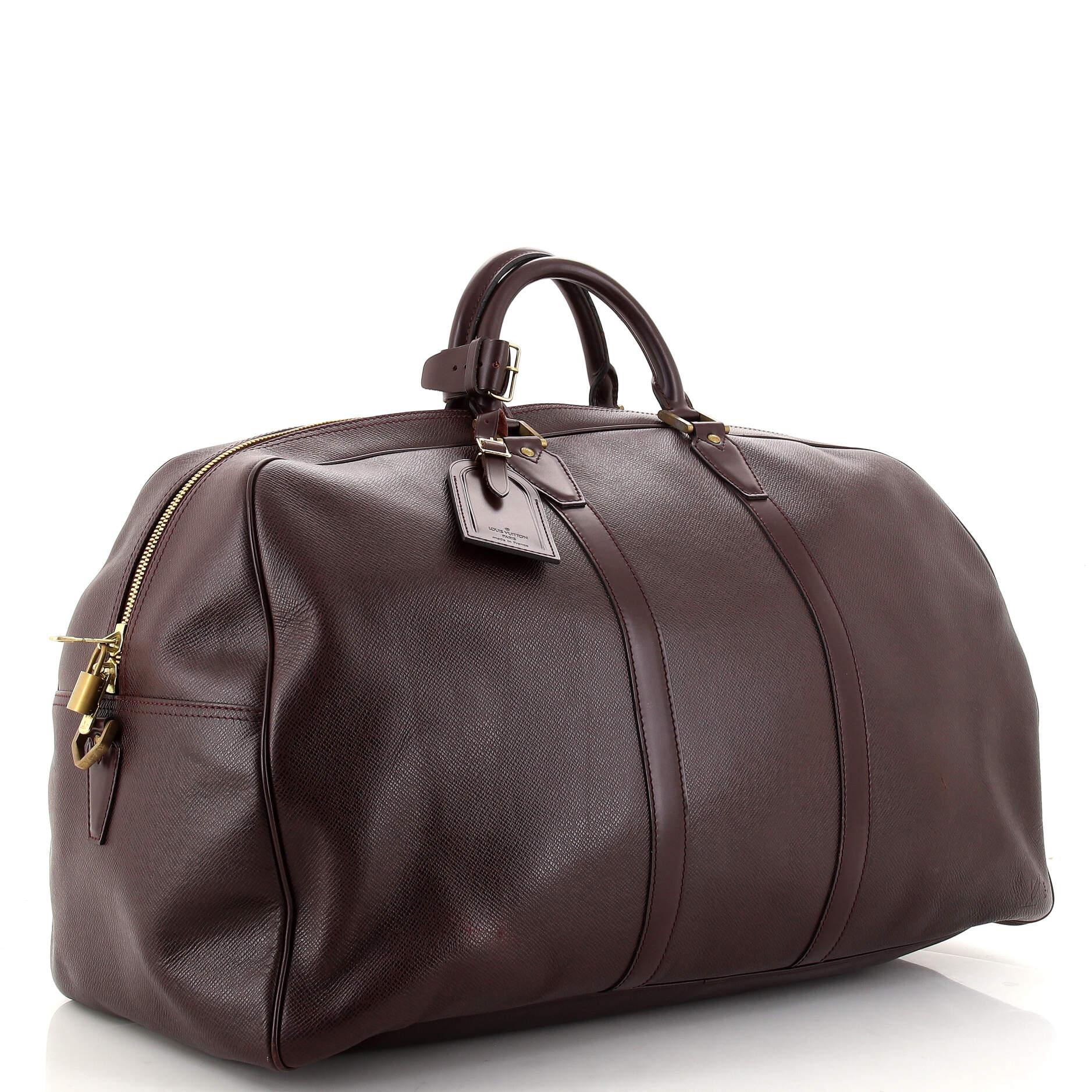 Condition: Good. Wear and loss of shape on exterior, minor wear and and darkening on handles, light wear in interior, scratches and tarnish on hardware.
Accessories: Lock, Poignet, Luggage Tag
Measurements: Handle Drop 4