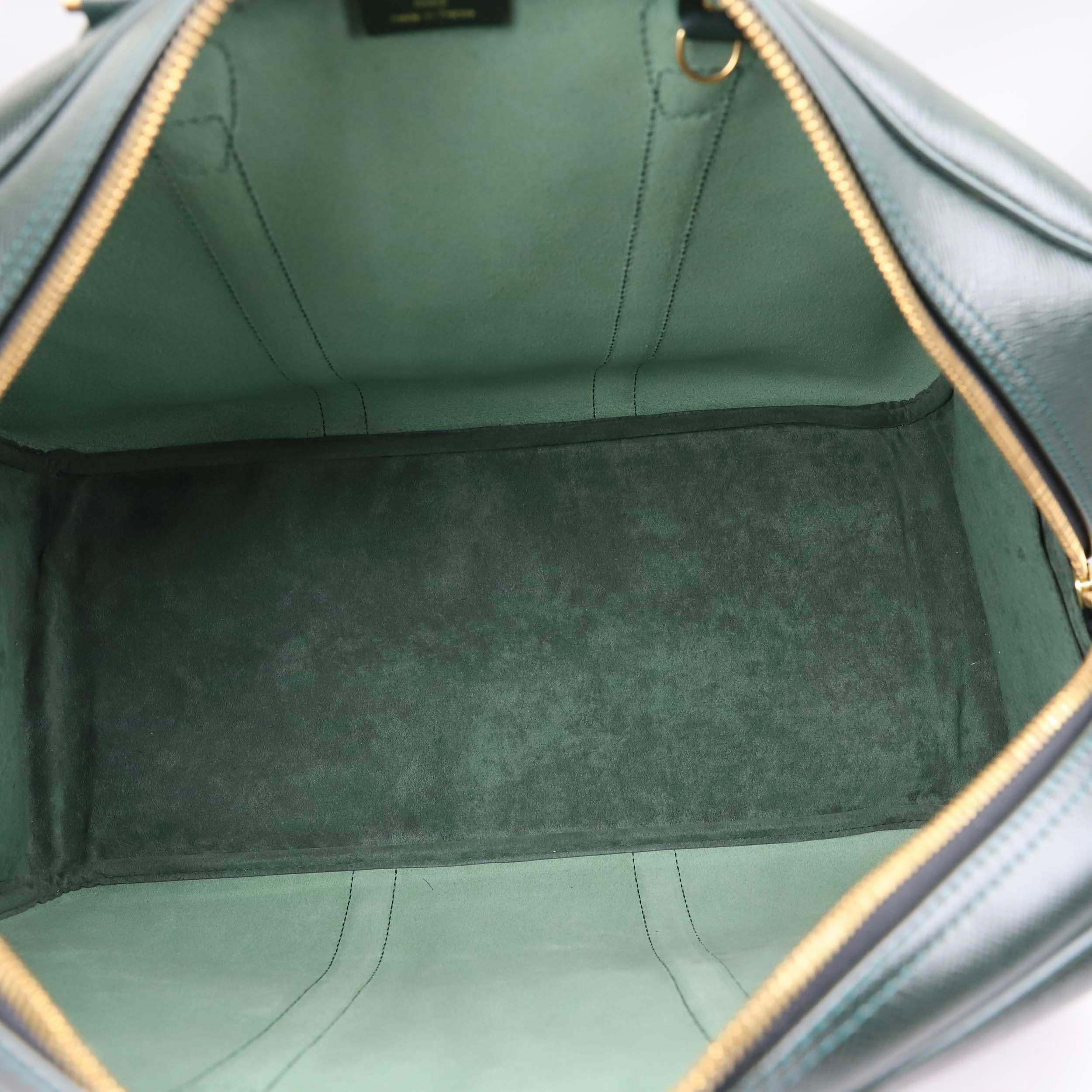 Travel in style with this Louis Vuitton Epicea Green Taiga bag in classic Kendall Keepall leather. This lovely travel bag is perfect for anyone who wants to carry their precious travel essentials in sleek style. It features beautiful taiga green