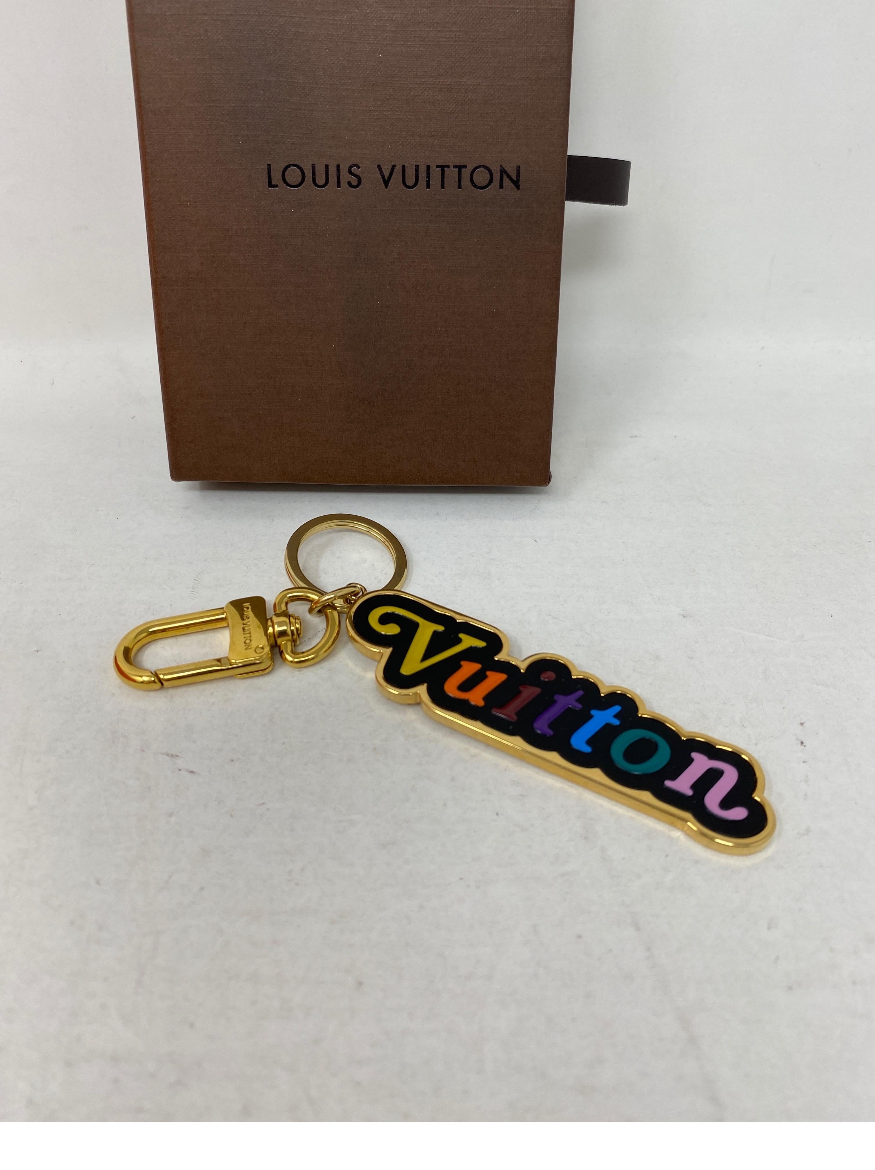 Louis Vuitton Key Holder. Rainbow lettering. Gold hardware. Excellent like new condition. Guaranteed authentic. 