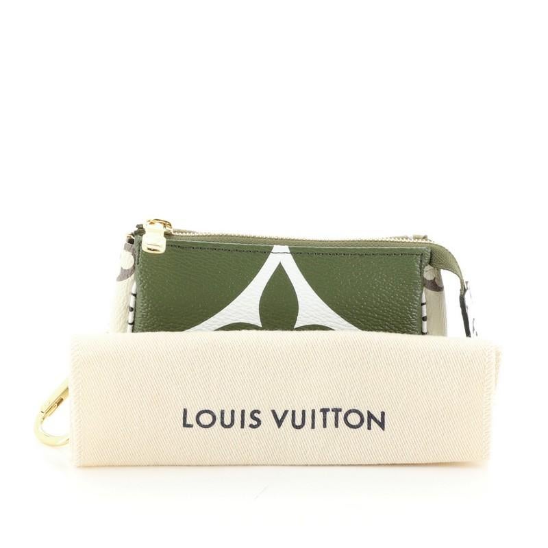 This Louis Vuitton Key Pouch Limited Edition Colored Monogram Giant, crafted in green and multicolor coated canvas, features a chain with hook and gold-tone hardware. Its zip closure opens to a neutral fabric interior. Authenticity code reads: