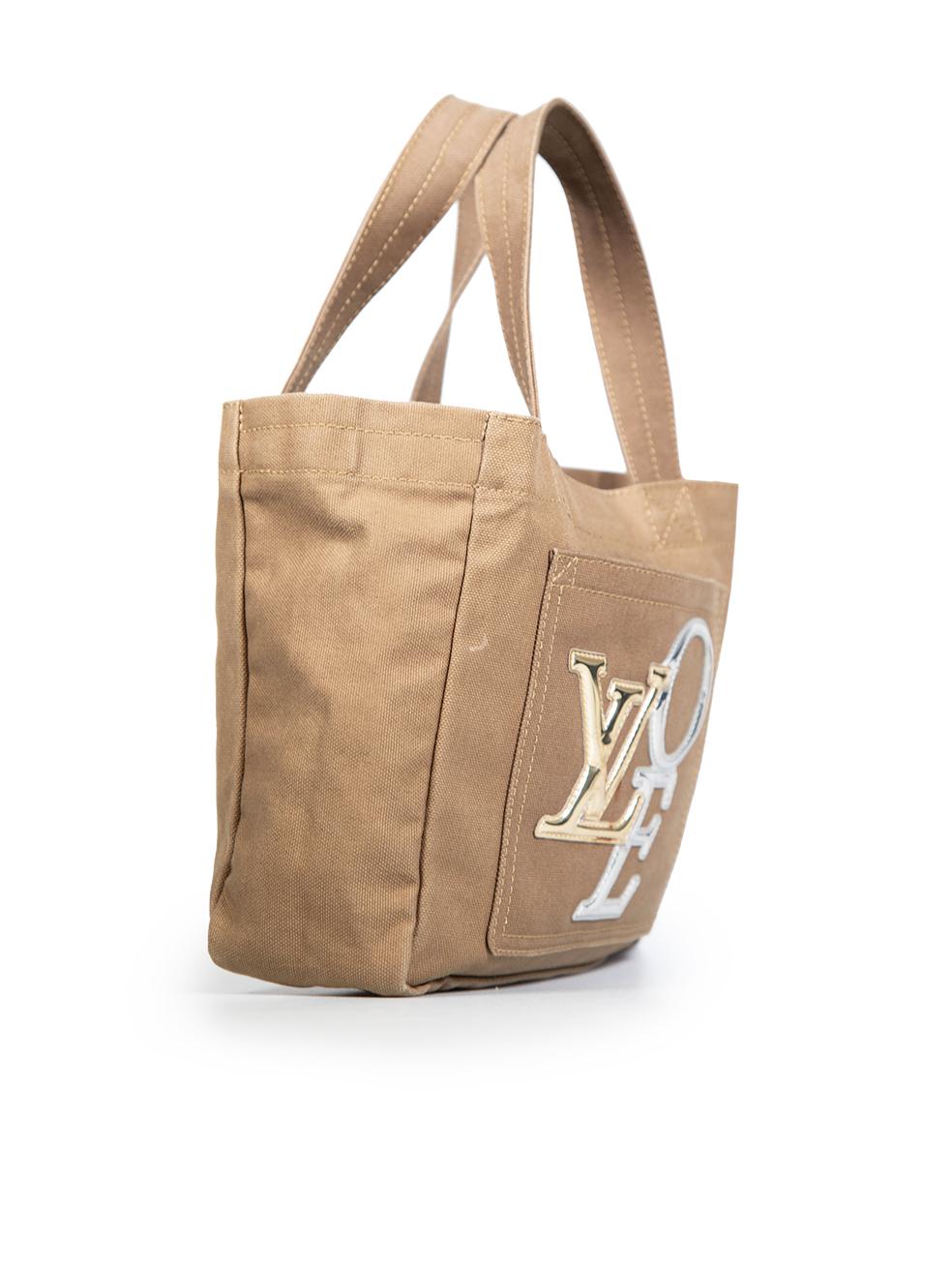 CONDITION is Very good. Minimal wear to bag is evident. Light discolouration and creasing to the gold and silver lettering at the centre of the bag on the front pocket. There are also small marks to the side, back, handles and on the lining at the