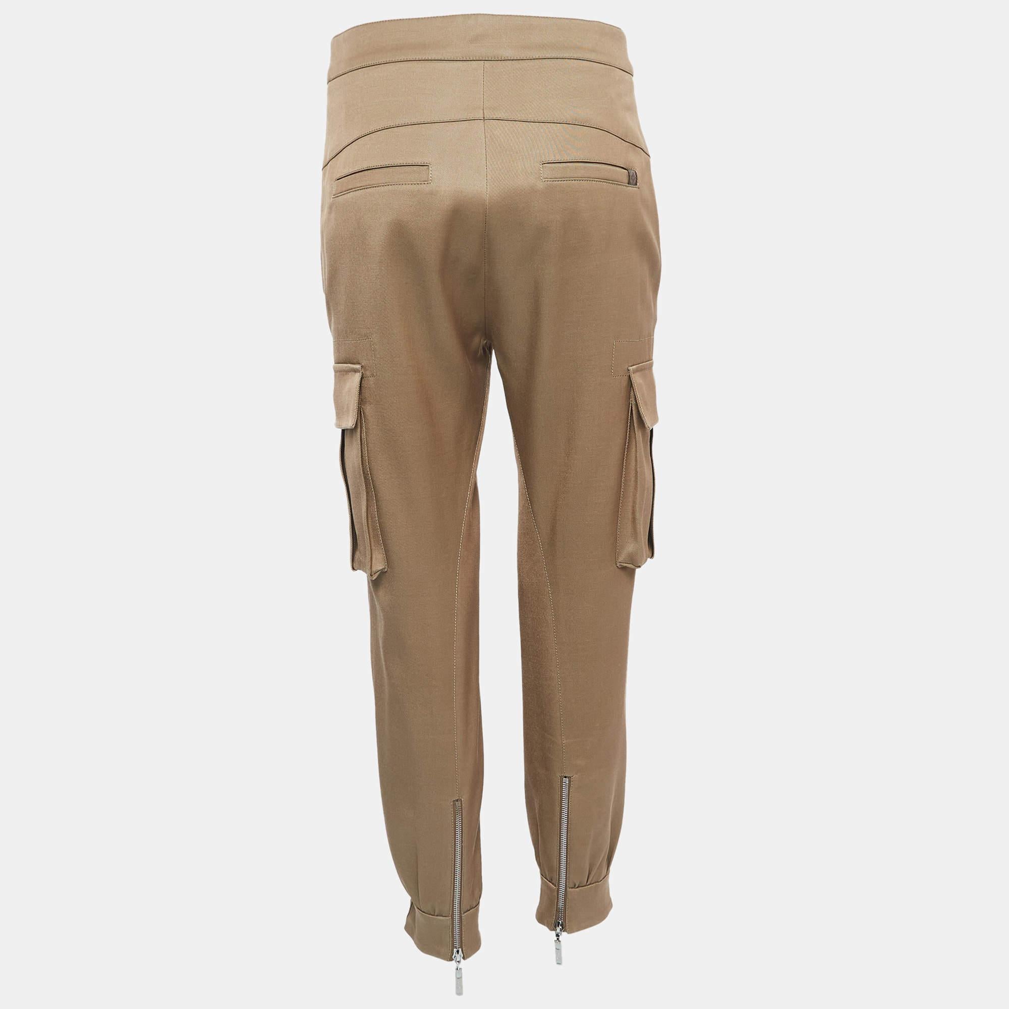 Style these pants with your favorite blouses or shirts and create effortlessly chic looks. They are stitched using quality fabrics and showcase a superb fit. These Louis Vuitton cargo pants feature a diagonal zipper and band all the way from the