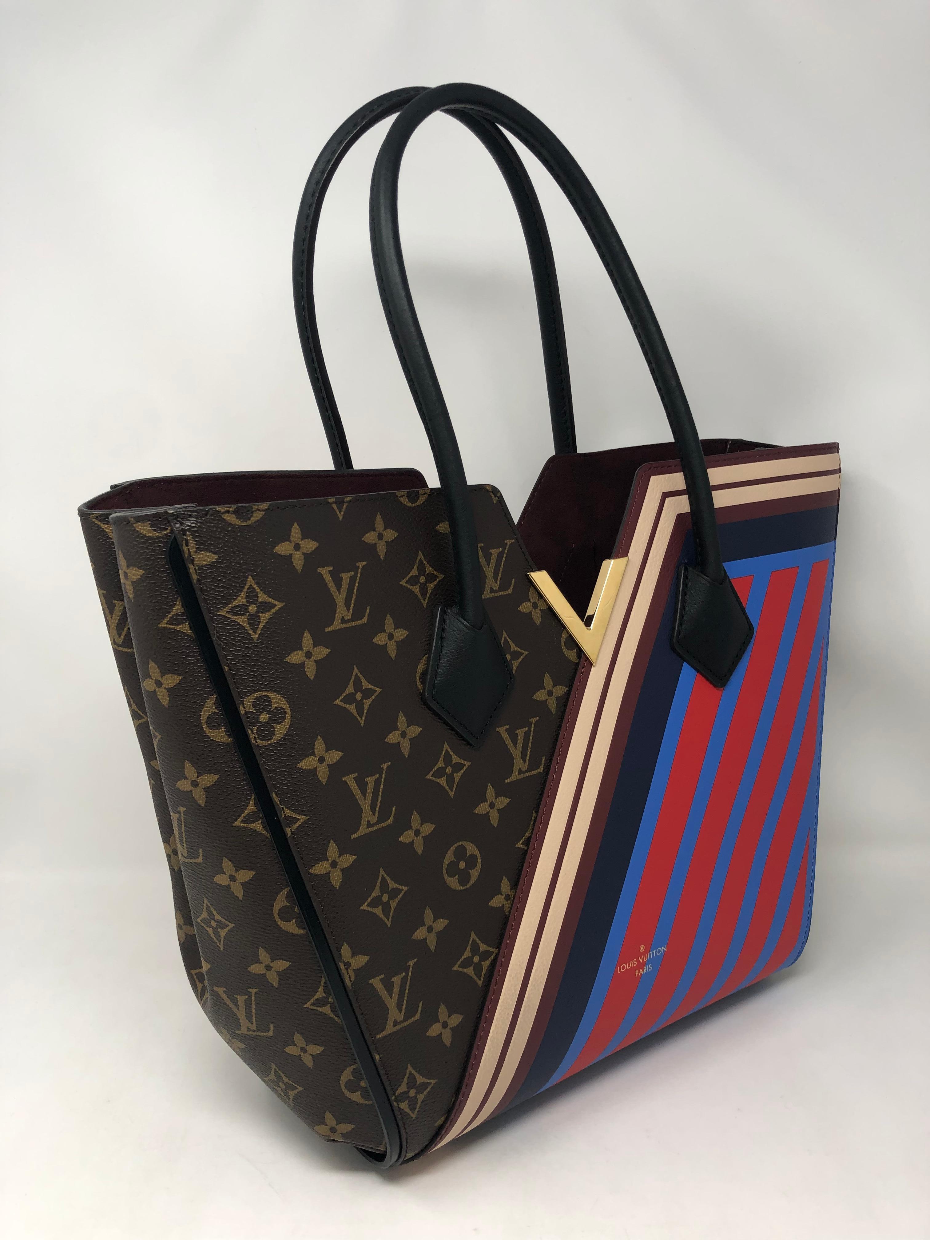 Louis Vuitton Kimono Bag Limited Edition. Monogram and red, blue stripes on this bag. Rare and in brand new condition. Unique look and highly coveted. Guaranteed authentic. 