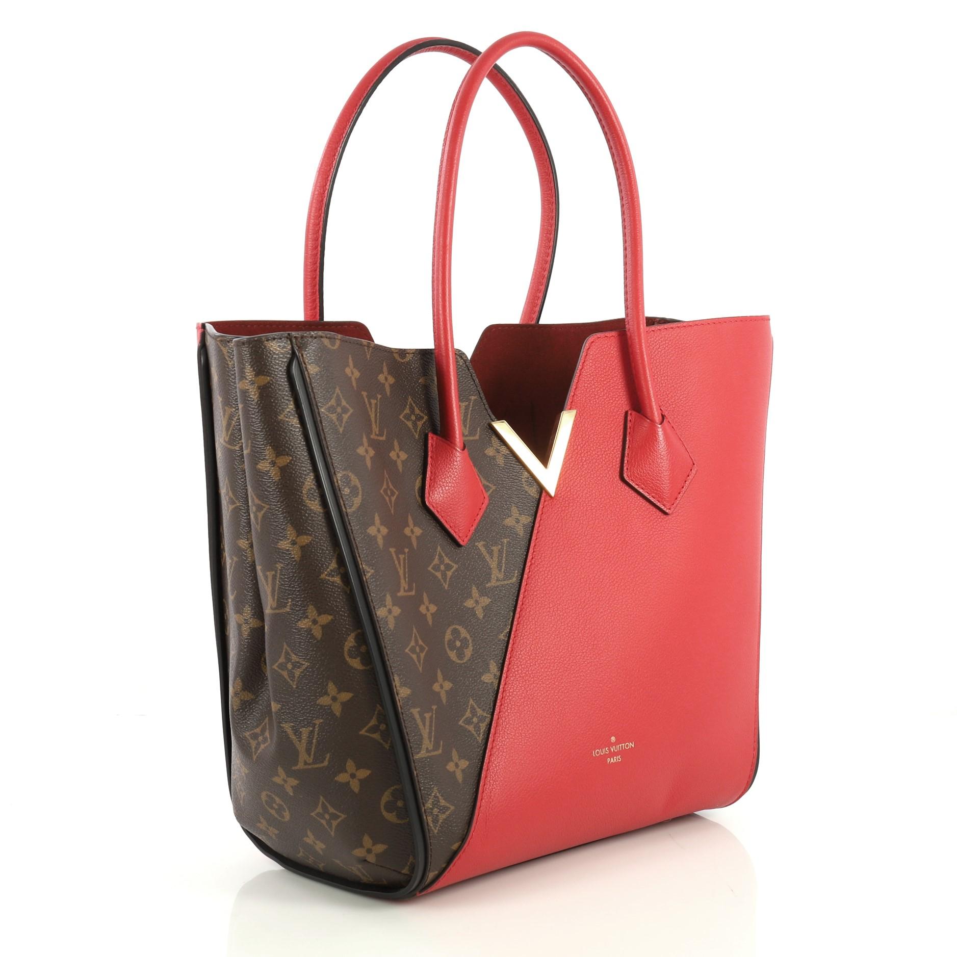 This Louis Vuitton Kimono Handbag Monogram Canvas and Leather MM, crafted from brown monogram coated canvas and red leather, features dual rolled top handles, metallic V-cross accent, and gold-tone hardware. Its wide top with hook-clasp closure