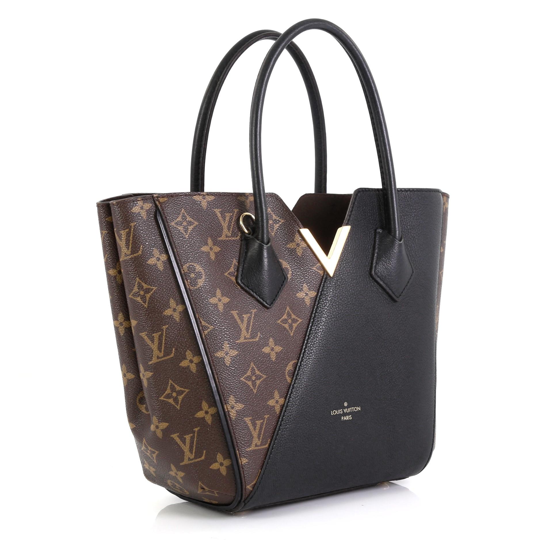 This Louis Vuitton Kimono Handbag Monogram Canvas and Leather PM, crafted from brown monogram coated canvas and leather, features dual rolled handles, metallic V accent, and gold-tone hardware. Its wide top with hook-clasp closure opens to a brown