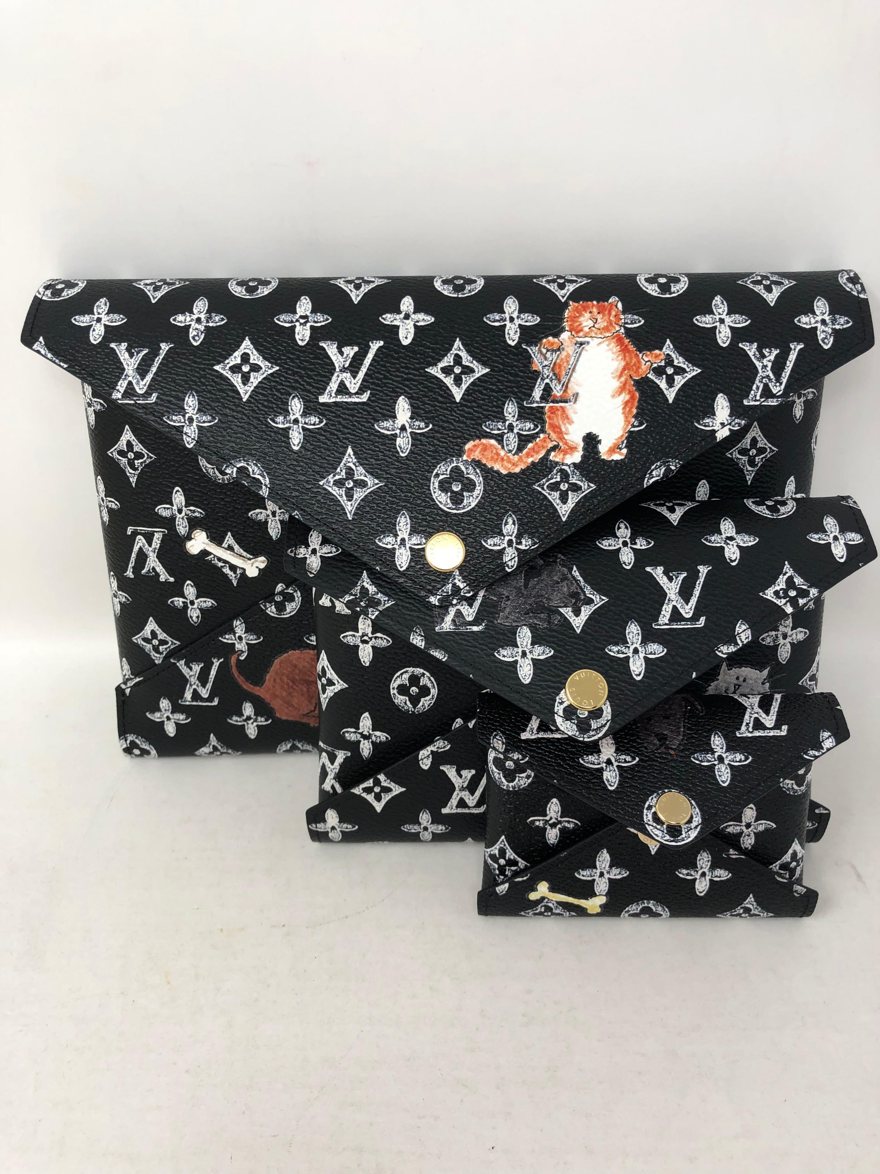 Louis Vuitton Kirigami Monogram Catogram Large Clutch. Designed by Grace Coddington for LV. Pop Up Exclusive. Very limited and rare. The Kirigami is a 3 piece set that is functional for everyday or for travel. Own this iconic piece. Includes