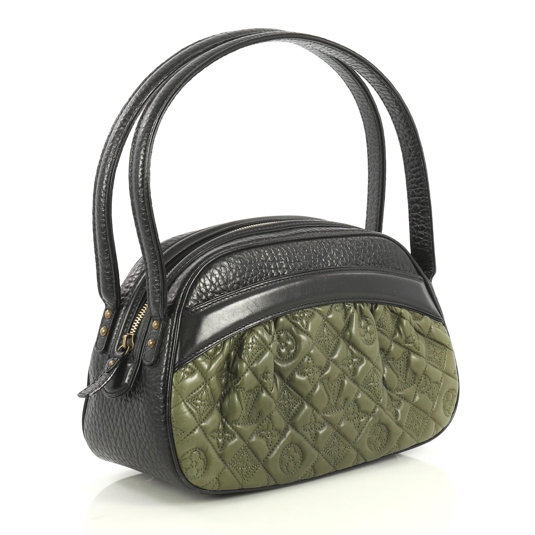 This Louis Vuitton Klara Vienna Handbag Monogram Quilted Lambskin, crafted from black and green lambskin leather, features dual flat leather handles, monogram quilted embroidery, exterior slip pocket, protective base studs and aged gold-tone