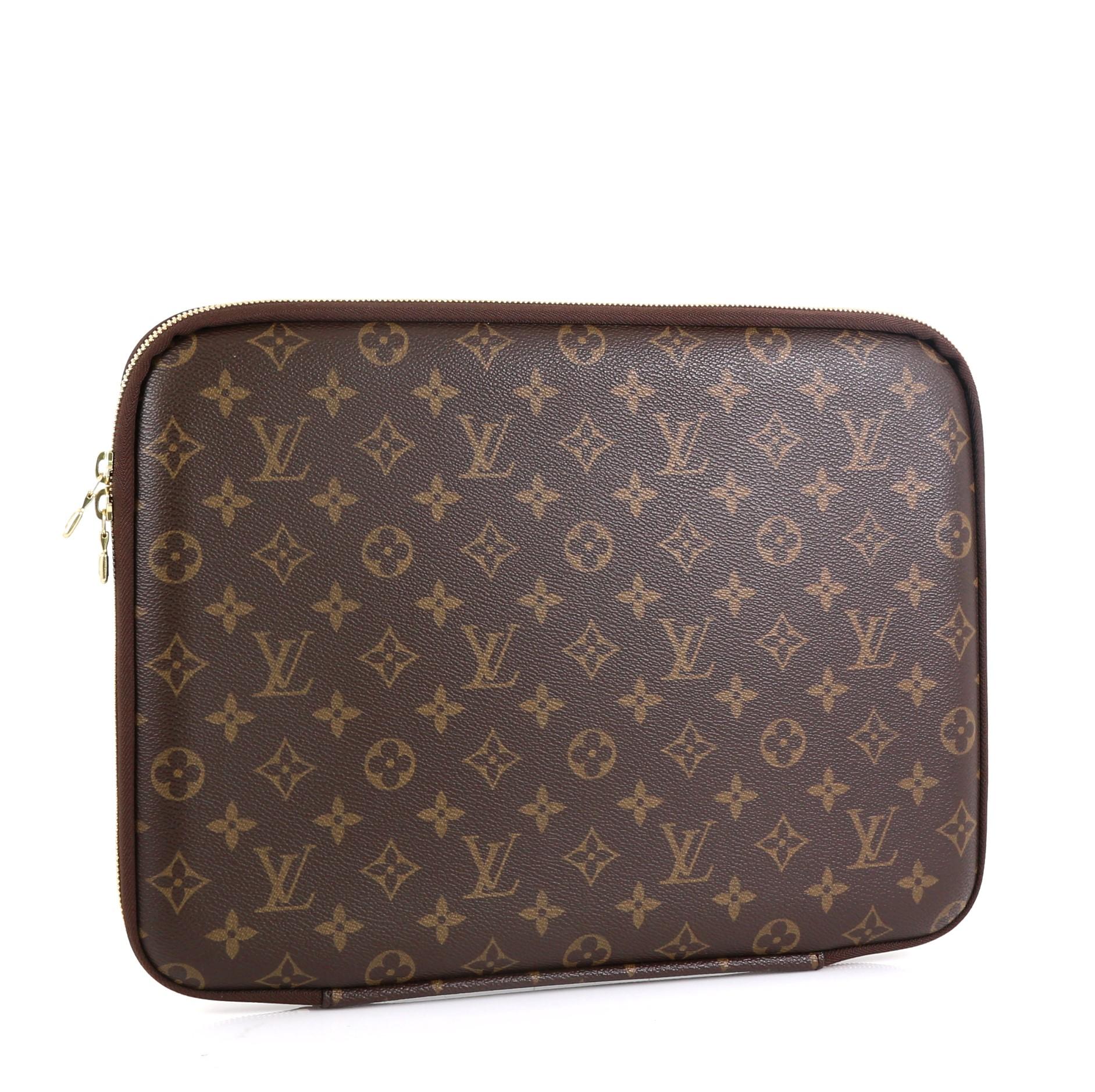 This Louis Vuitton Laptop Sleeve Monogram Canvas 13, crafted from brown monogram coated canvas, features foam-lined protective laptop compartment, Louis Vuitton Inventeur signature inside and gold-tone hardware. Its all-around zip closure opens to a