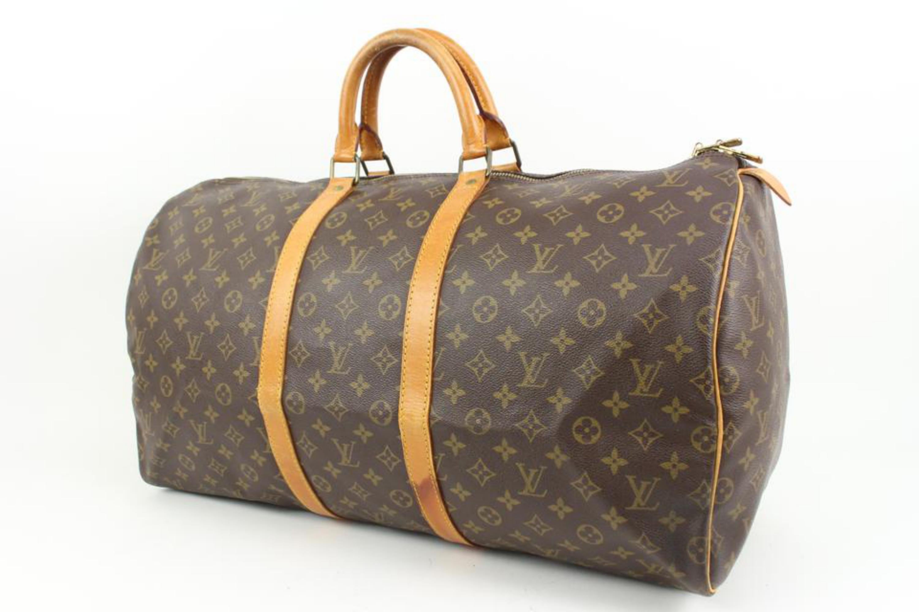 Louis Vuitton Large Monogram Keepall 55 Boston Duffle Bag 89lz418s
Date Code/Serial Number: MI 874
Made In: France
Measurements: Length:  22