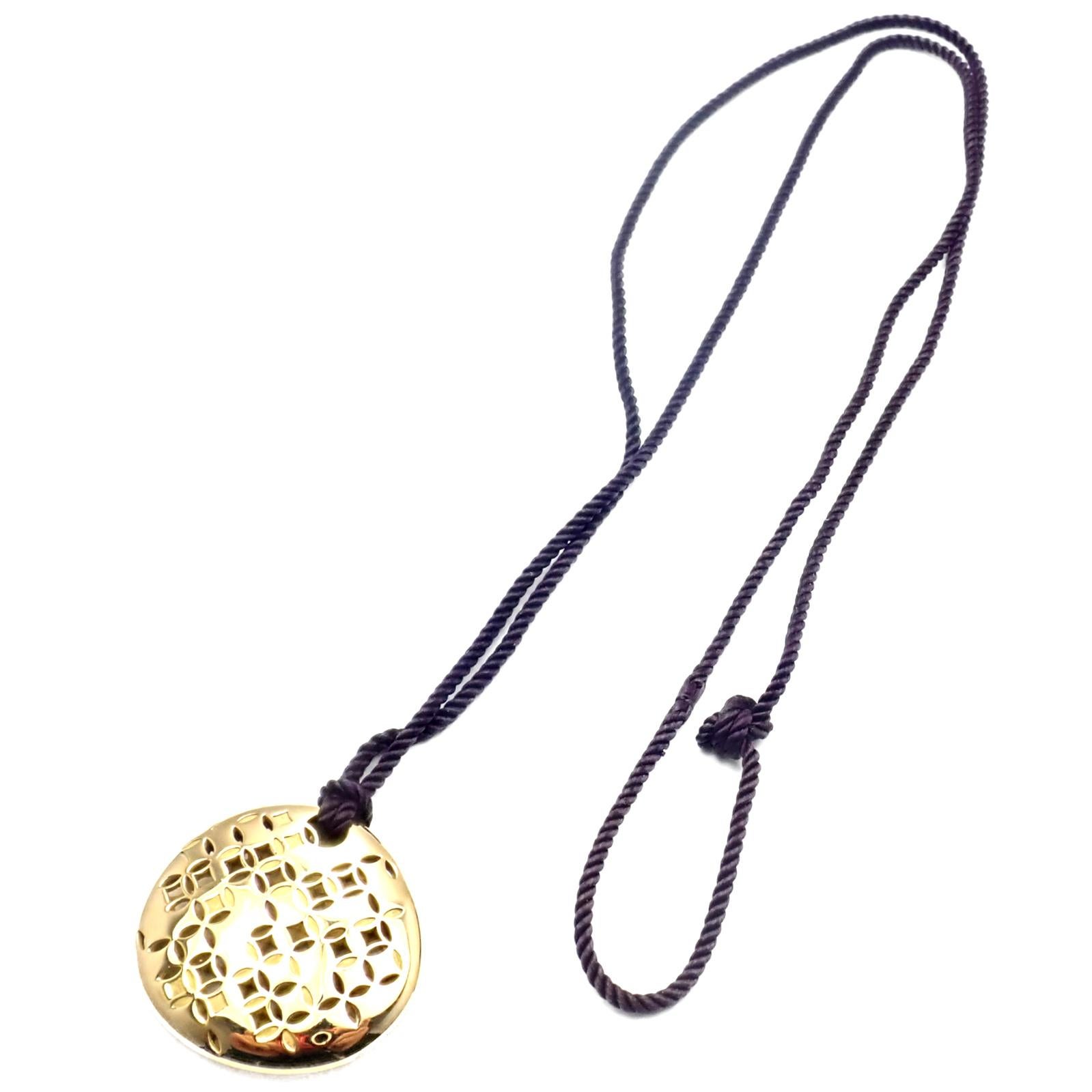 18k Yellow Gold Large Pendant Necklace by Louis Vuitton. 
Details: 
Length: Silk Cord Adjustable up to 32