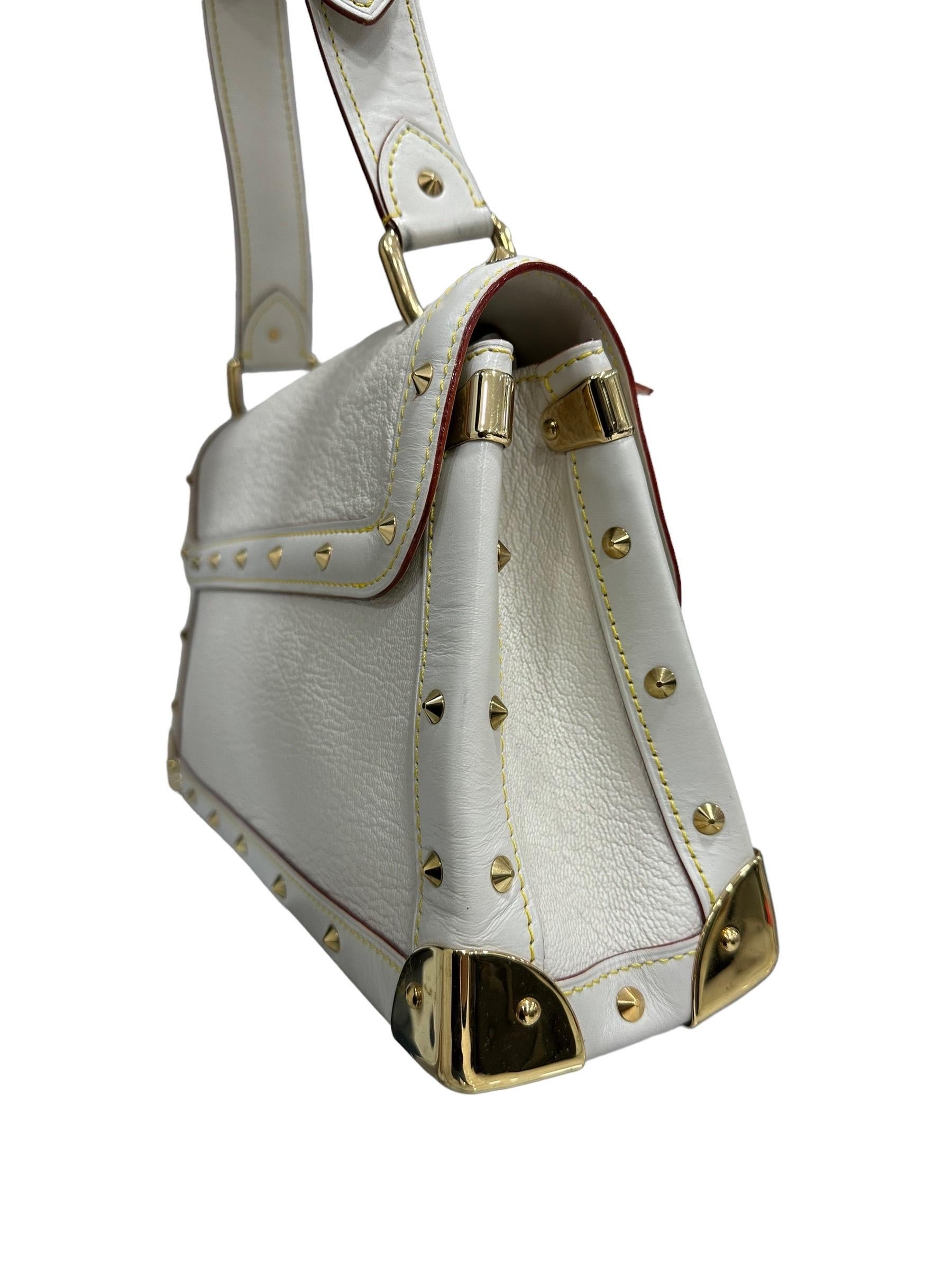 Louis Vuitton bag, Le Talentueux model, made in cream colored Suhali leather with gold hardware. Featuring a front flap closure and snap button closure. Equipped with an adjustable leather handle for easy hand carrying. Enriched with studs along the