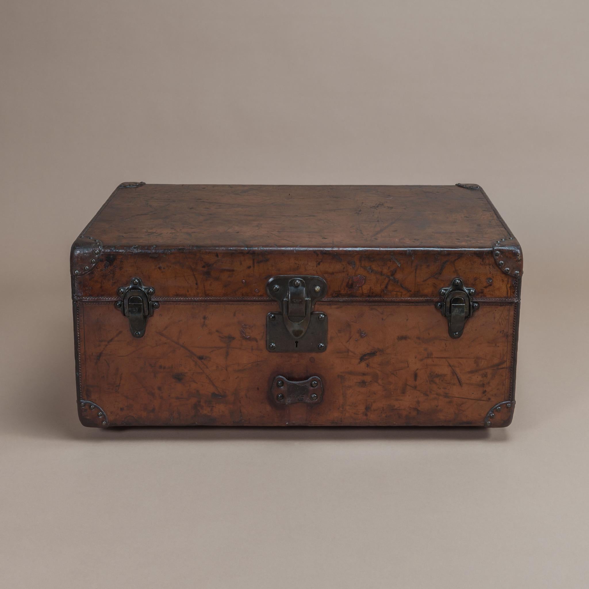 A wonderful smaller sized natural leather covered Louis Vuitton cabin trunk that has built up a rich colour and attractive patina with age. Has original leather handles & brass fittings and has its original interior in-tact, circa