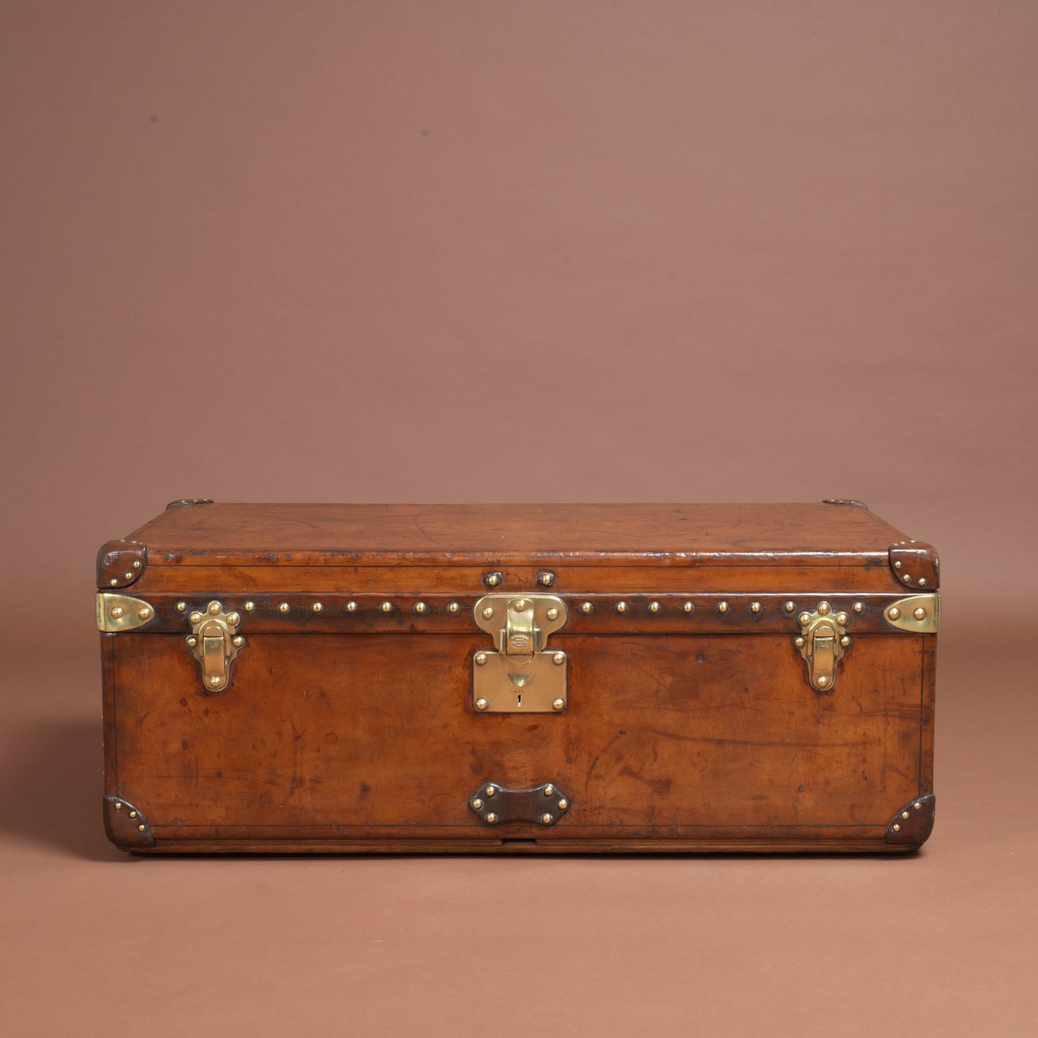 A well proportioned natural leather covered Louis Vuitton cabin trunk that has built up an attractive patina with age. Has original leather handles & brass fittings and has its original interior in-tact (including the original tray); Circa 1930. One