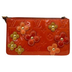 LOUIS VUITTON, A 'Vernis Lexington Fleurs Pochette'. - Bukowskis