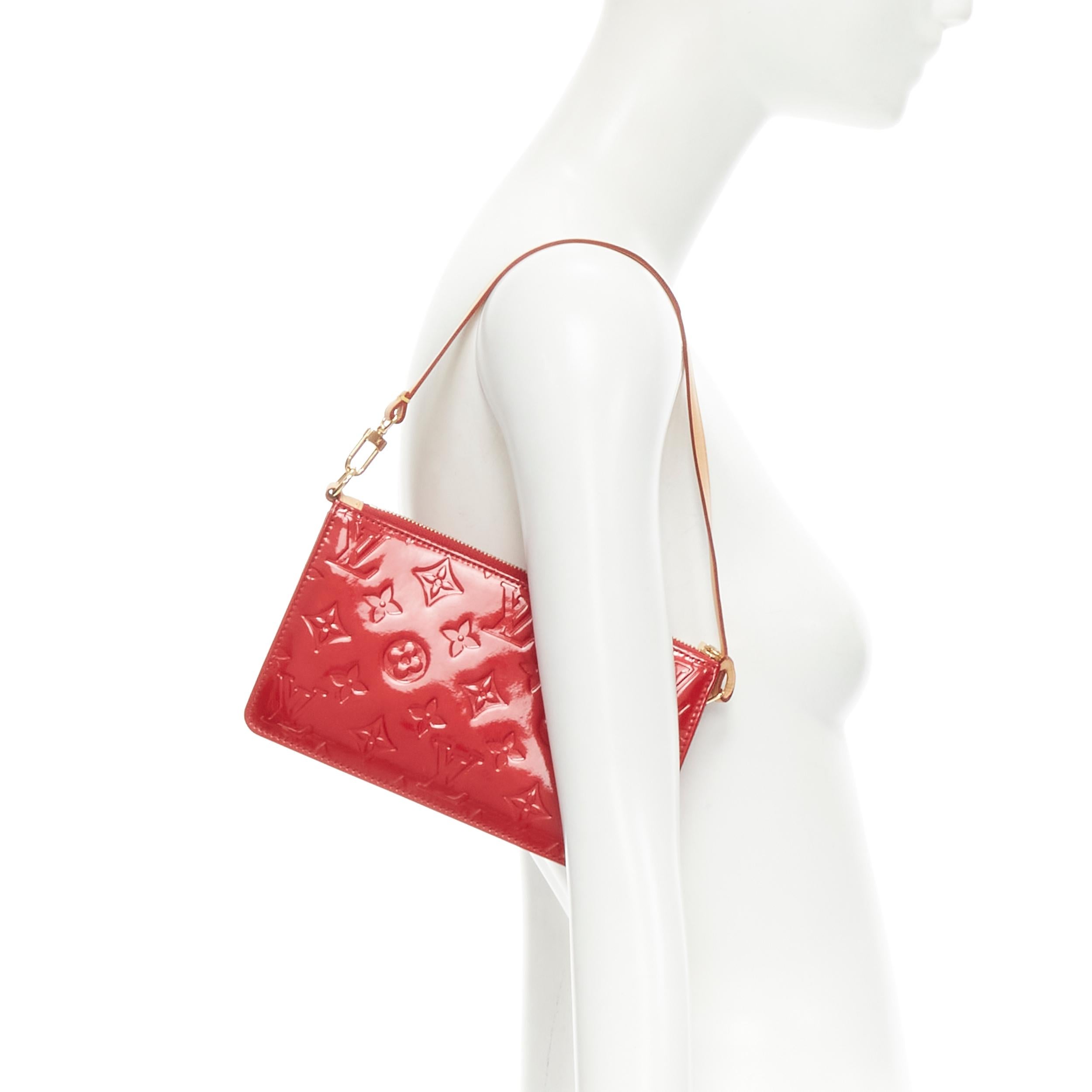 LOUIS VUITTON Lexington Red Vernis monogram patent pouchette underarm bag 
Reference: VACN/A00018 
Brand: Louis Vuitton 
Model: Lexington Red Vernis Pouchette 
Material: Patent Leather 
Color: Red 
Pattern: Solid 
Closure: Zip 
Extra Detail: Red