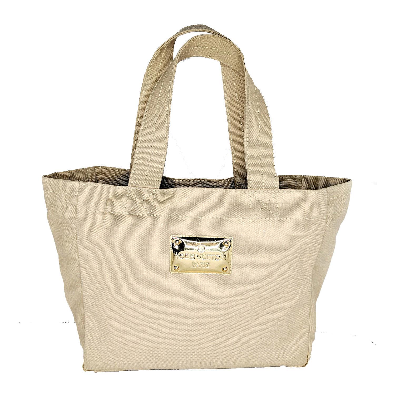 This unique Louis Vuitton Limited Edition Light Beige Canvas That's Love 2 Miroir tote features lightweight durable canvas construction for easy carrying when traveling or daily use. The signature Louis Vuitton Miroir lettering details on the front