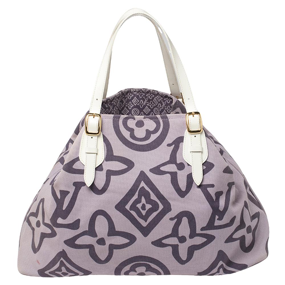 This special creation is for all Louis Vuitton collectors and lovers alike. Meticulously crafted from purple canvas, this dream bag is held by two leather handles with buckles and decorated with a subtle interpretation of their signature monogram