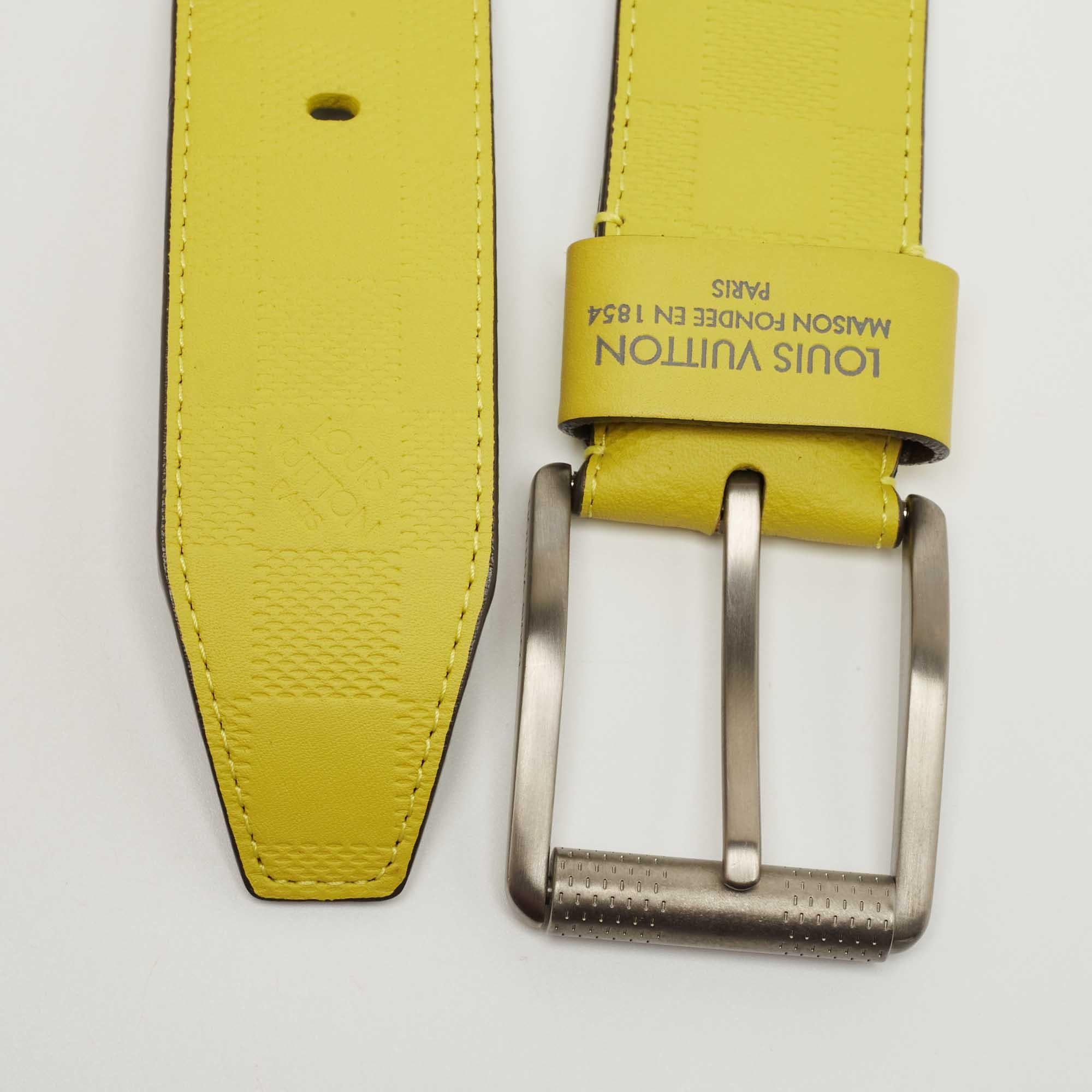 The Louis Vuitton belt is a luxurious fashion accessory crafted from high-quality lime-colored leather. It features an eye-catching damier embossed pattern and a stylish buckle, making it a statement piece for any outfit.

Includes: Original