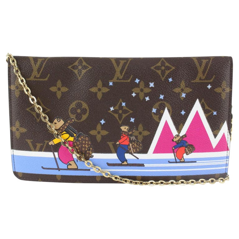 Louis Vuitton Limited Edition Monogram Canvas Skiing Bears WOC Pochette at  1stDibs