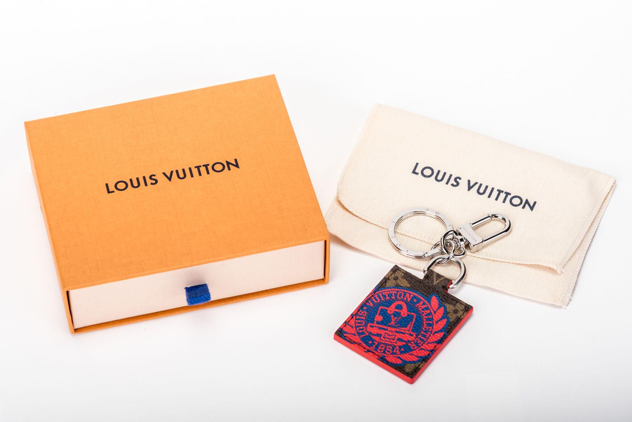 Louis Vuitton limited edition monogram bag charm with red-and-blue design. Brand new with dust cover and box.